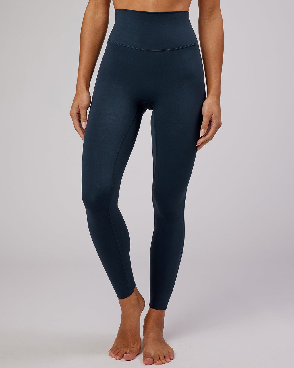Model wearing Elixir Full Length Tight - Navy No Logo