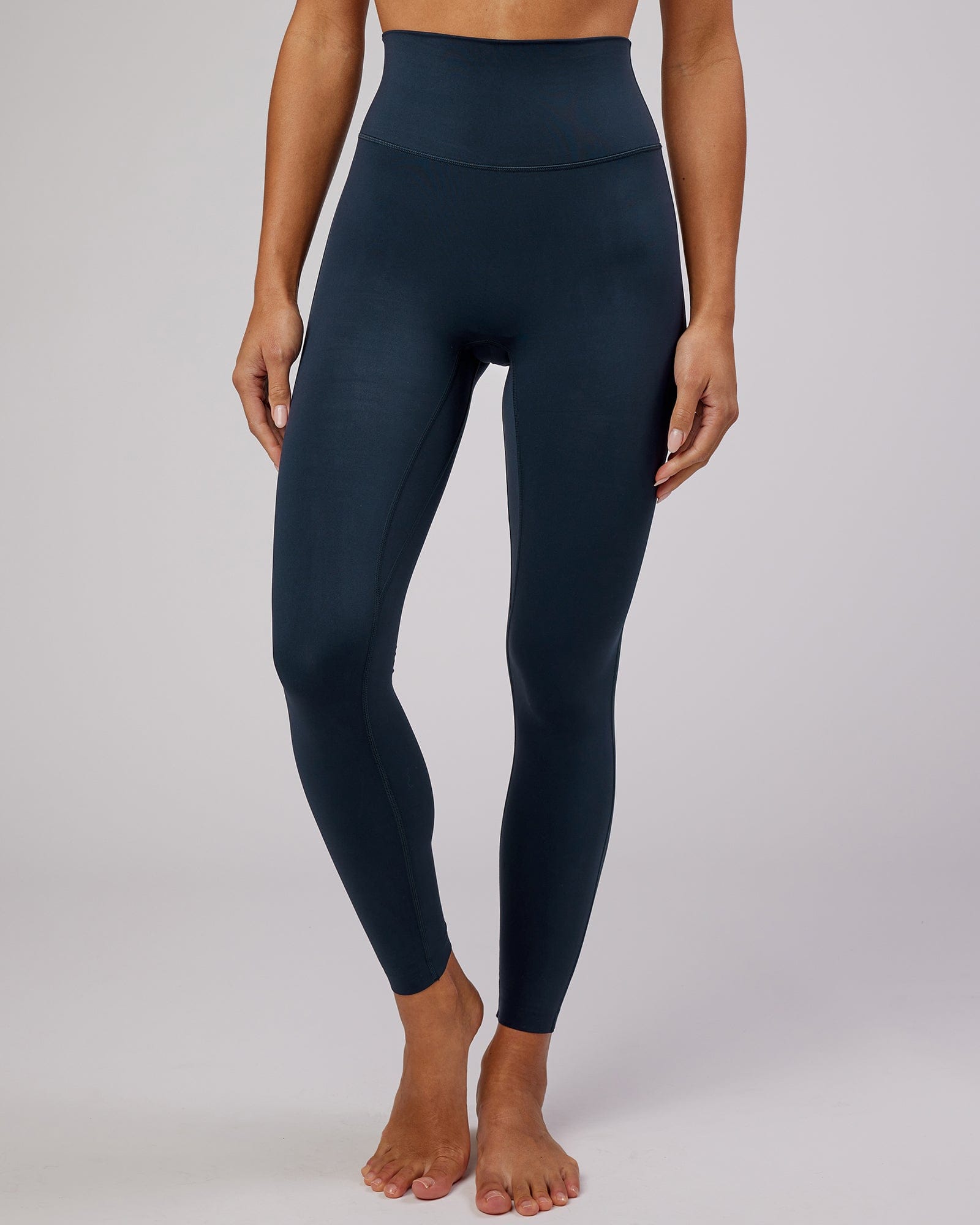 Model wearing Elixir Full Length Tight - Navy No Logo