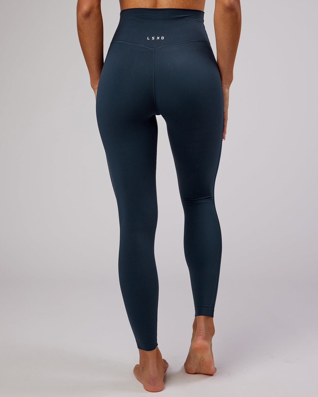 Model wearing Elixir Full Length Tight - Navy No Logo