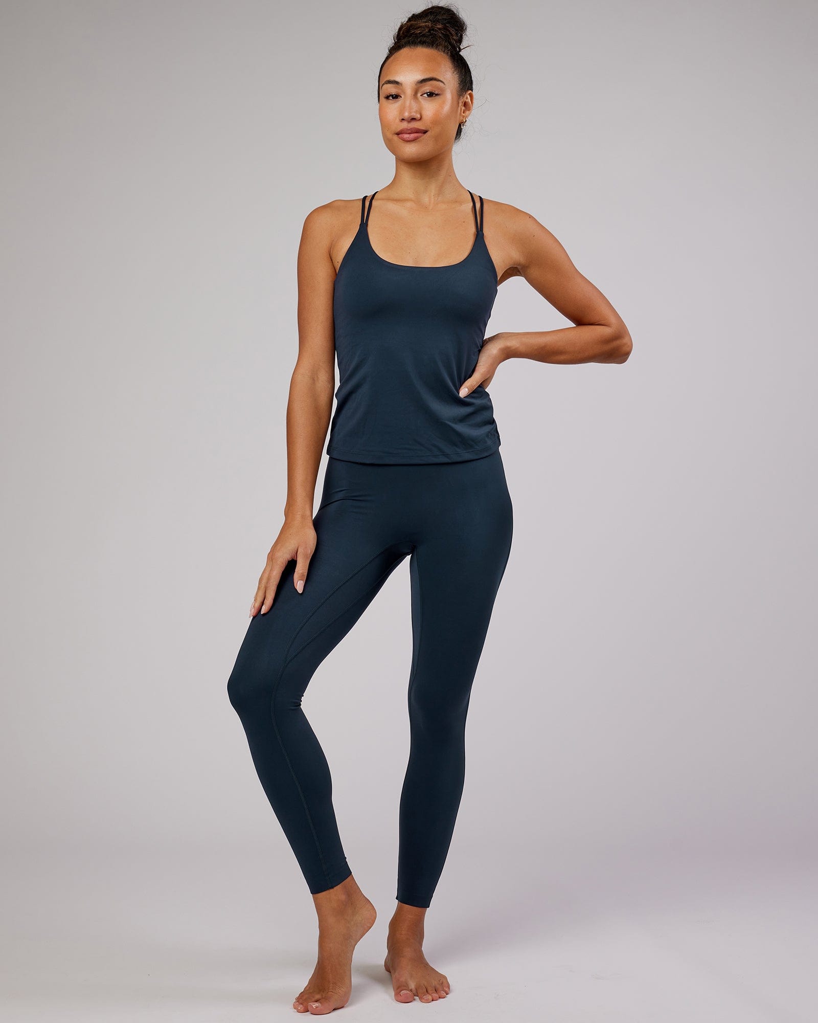 Model wearing Elixir Full Length Tight - Navy No Logo