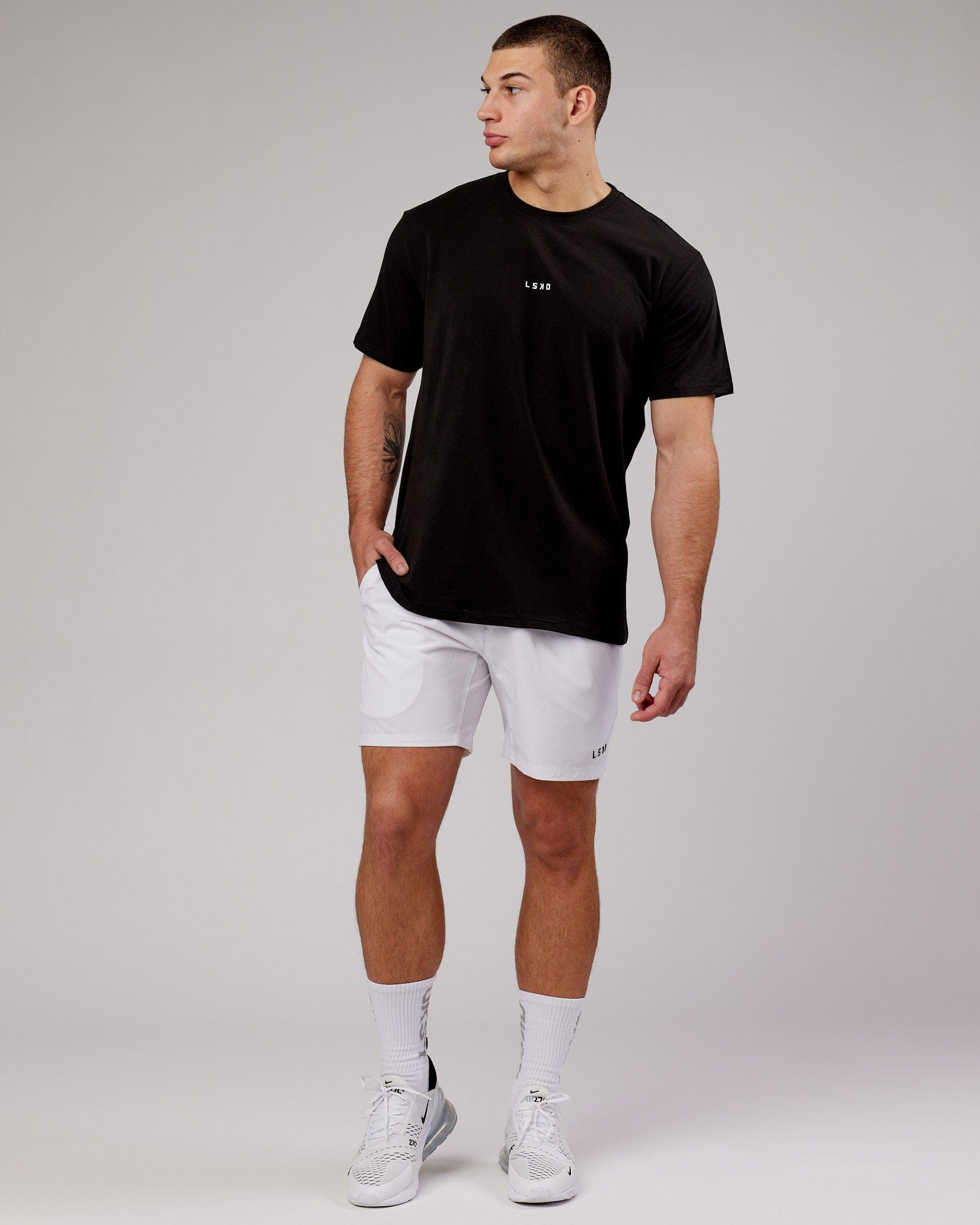 Model wearing Intensity 7" Performance Short - White