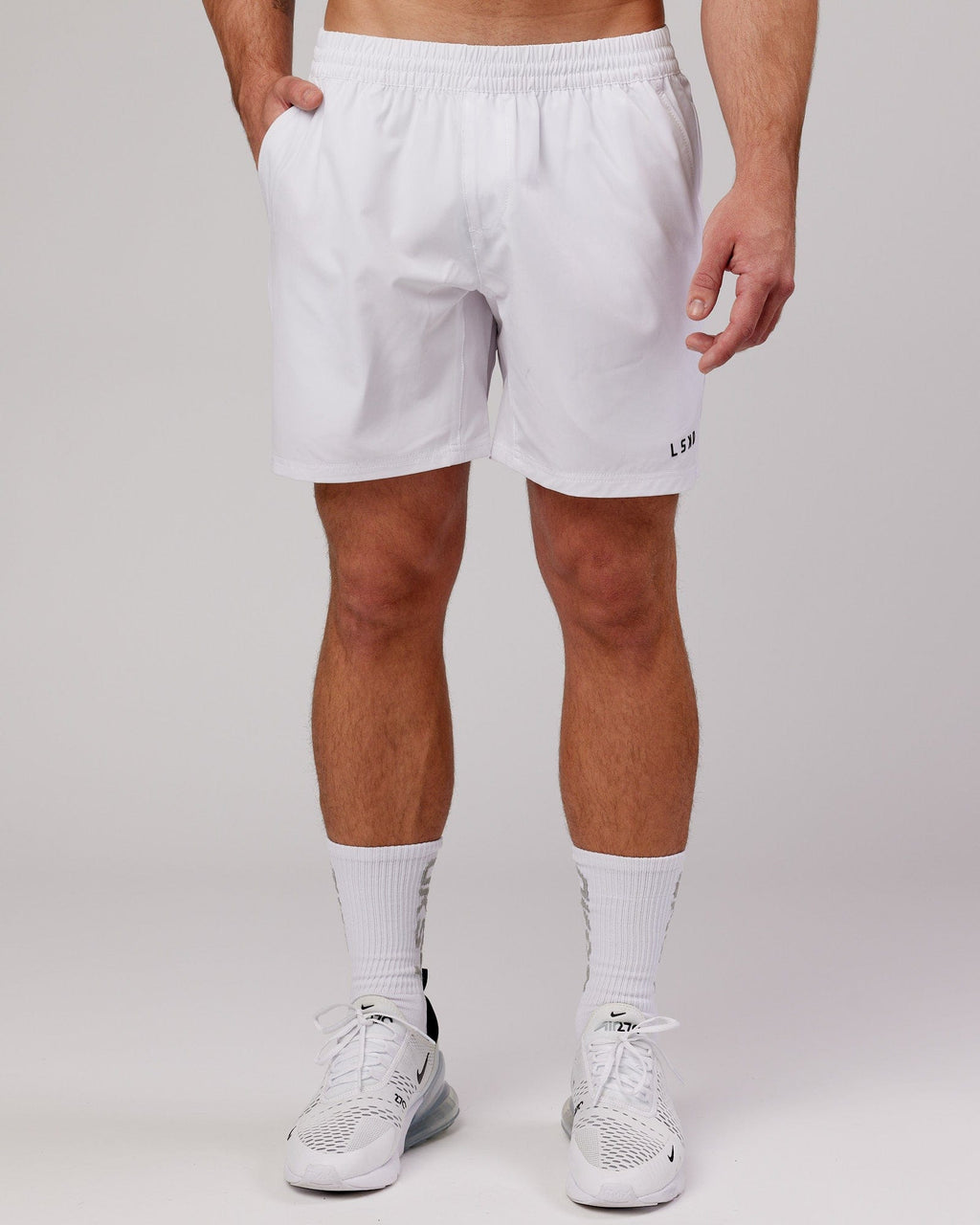 Model wearing Intensity 7" Performance Short - White