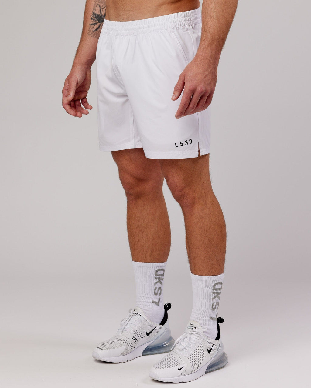 Model wearing Intensity 7" Performance Short - White