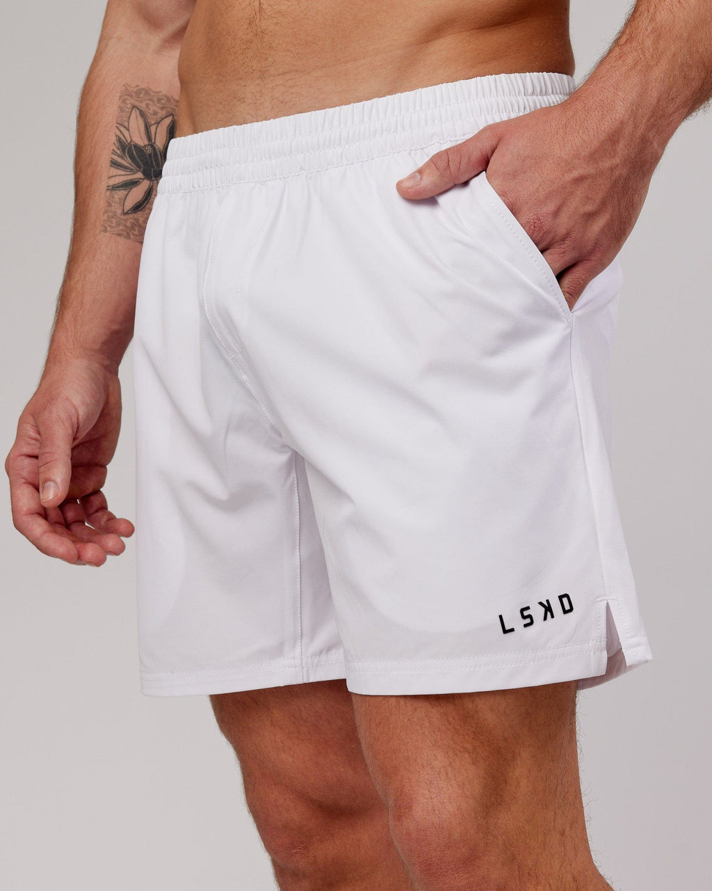 Model wearing Intensity 7" Performance Short - White