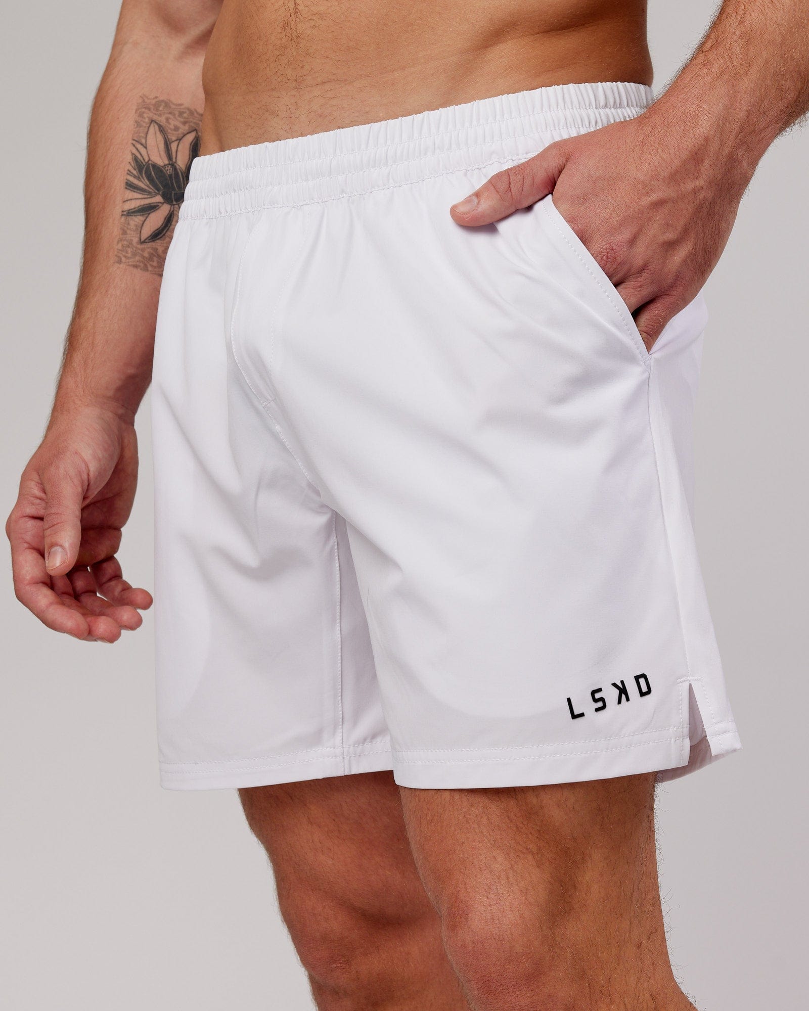 Model wearing Intensity 7" Performance Short - White