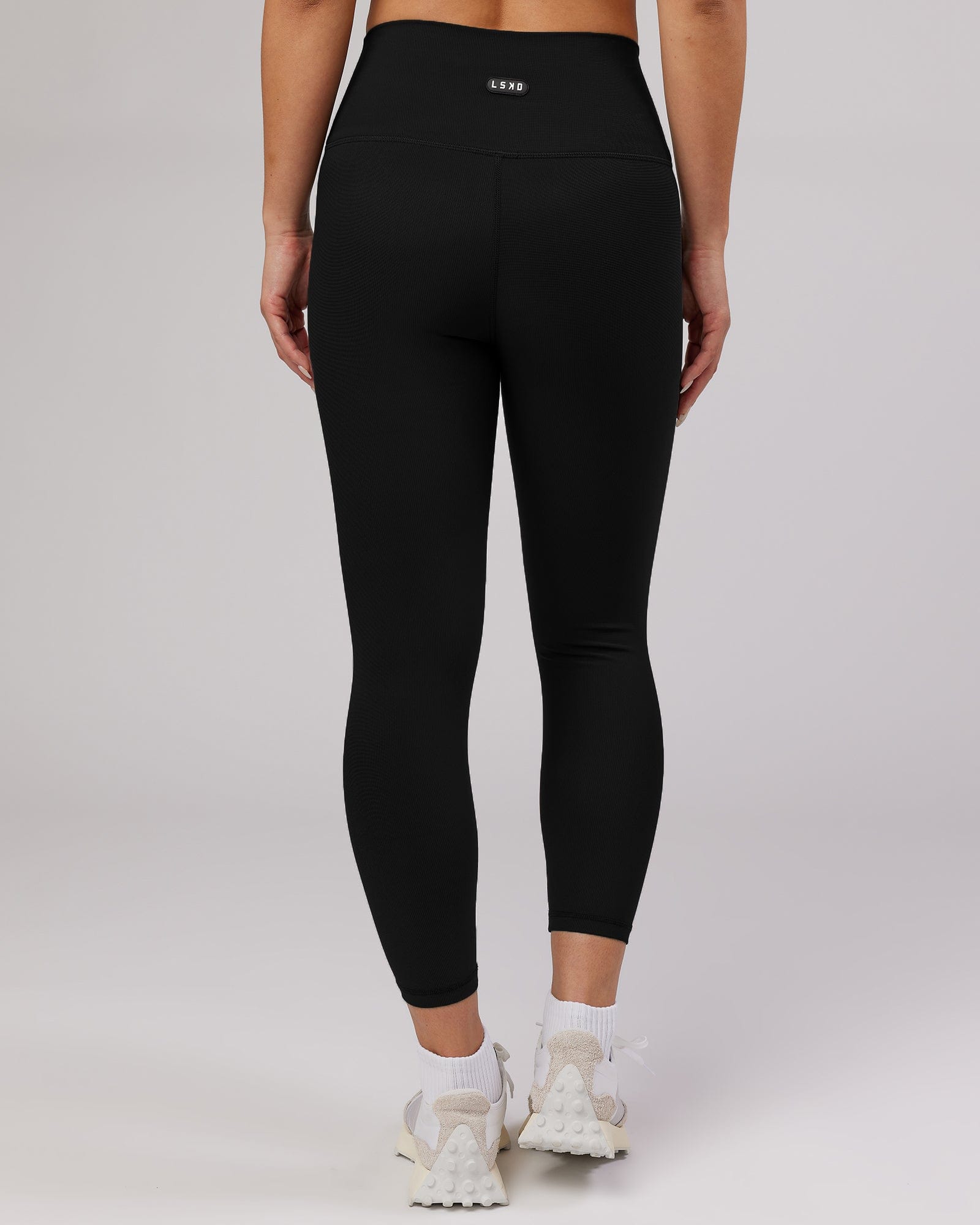 Model wearing Balance Ribbed 7/8 Length Tight - Black