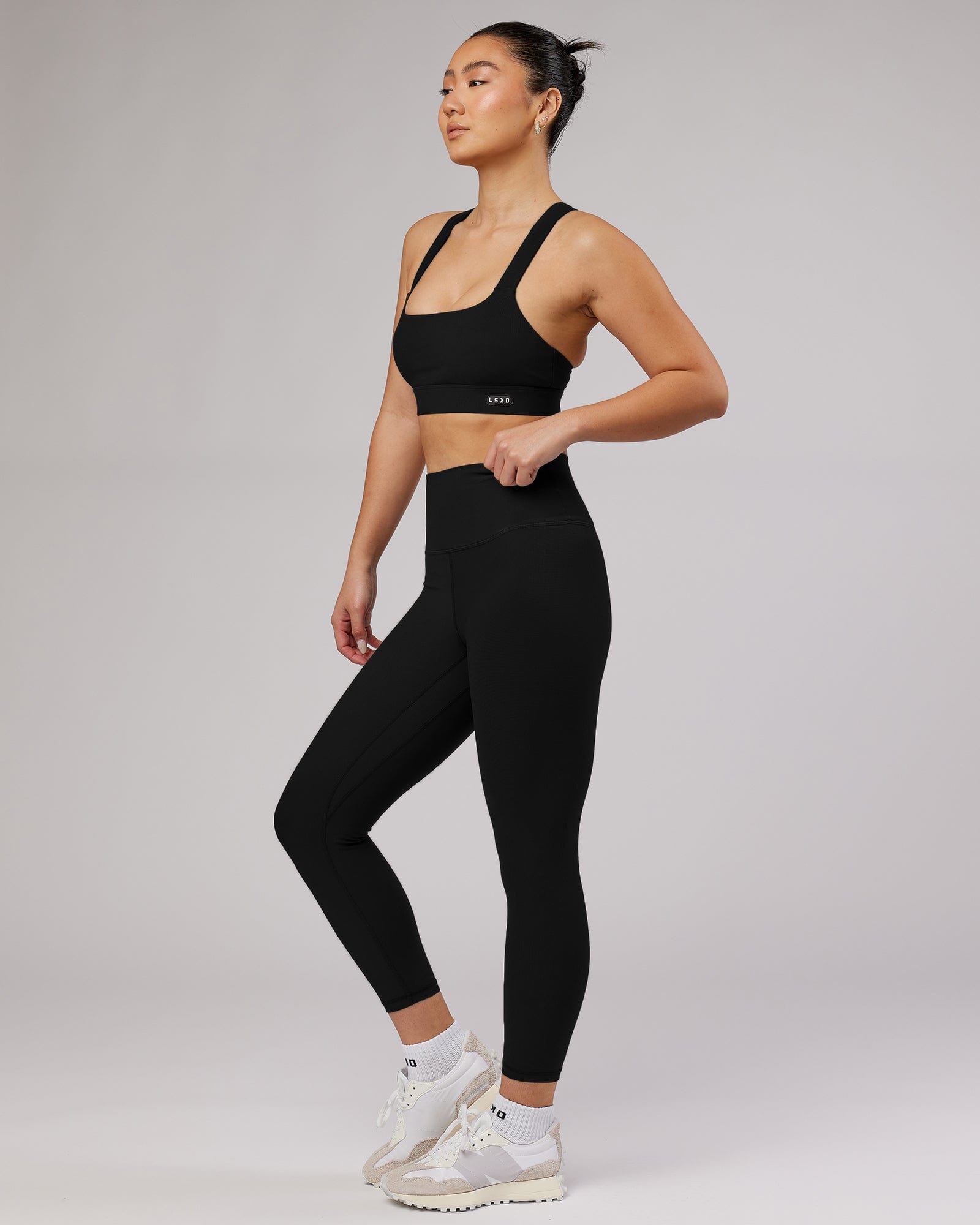 Model wearing Balance Ribbed 7/8 Length Tight - Black