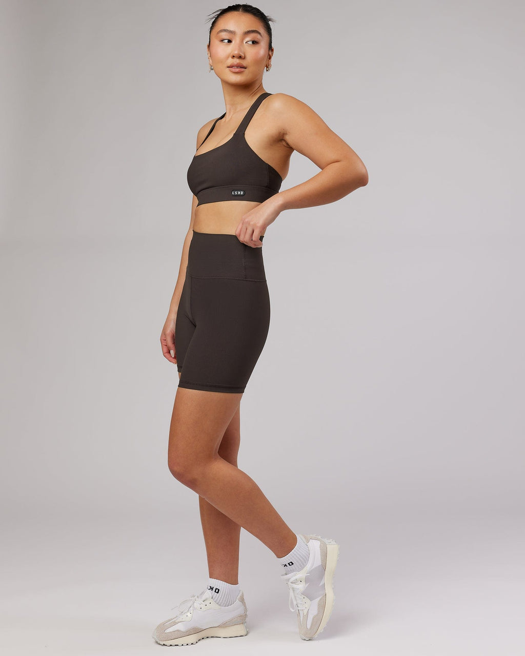 Model wearing Balance Ribbed Mid Short Tight - Dark Walnut