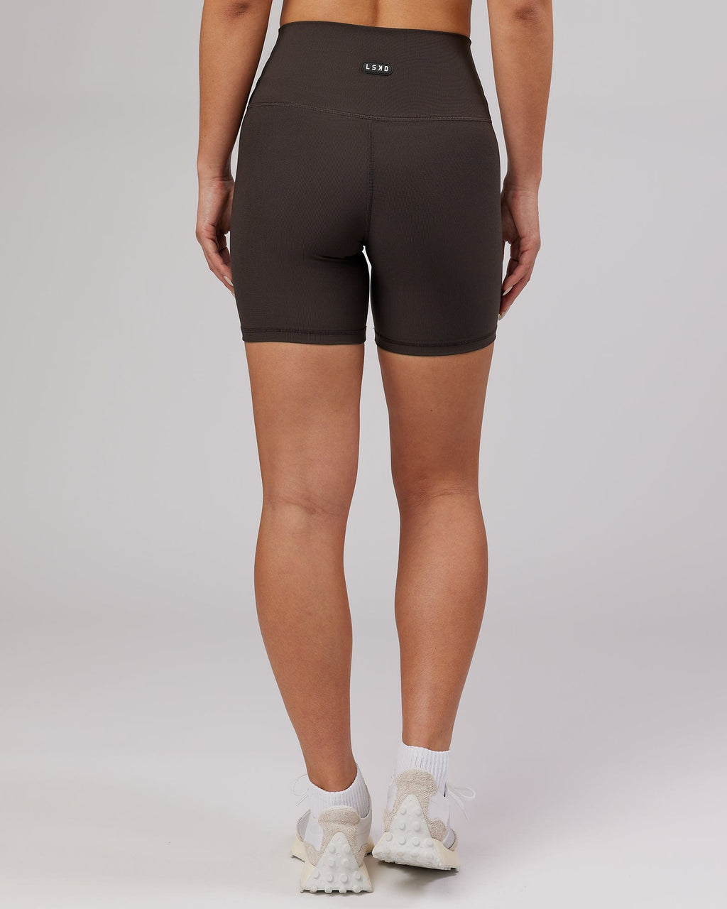 Model wearing Balance Ribbed Mid Short Tight - Dark Walnut