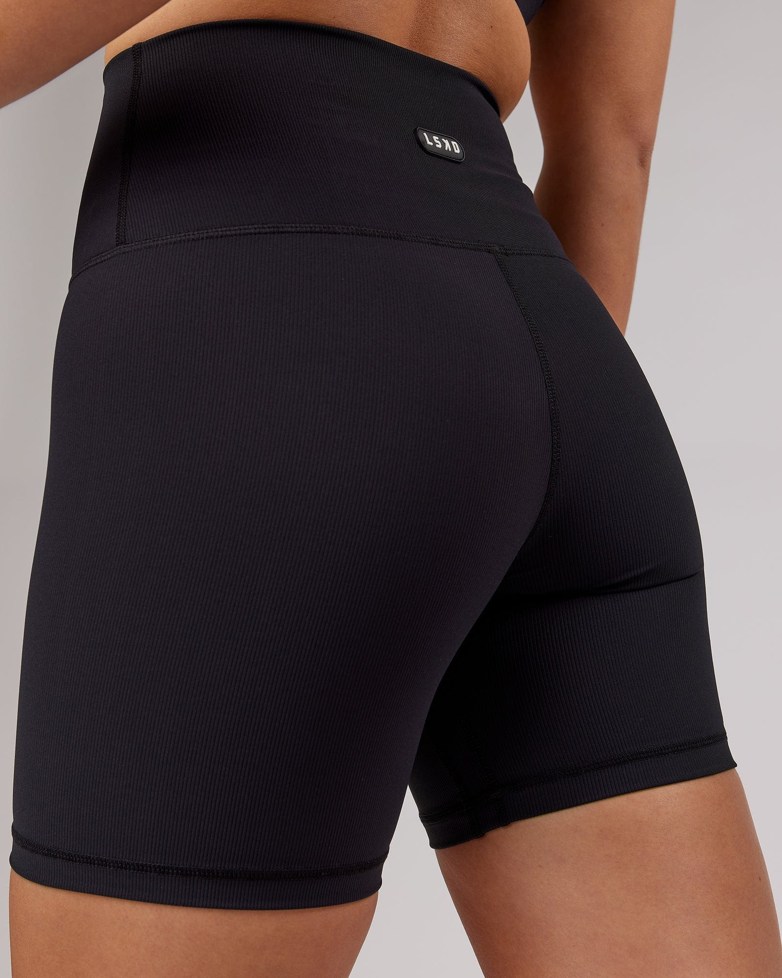 Model wearing Balance Ribbed Mid Short Tight - Black