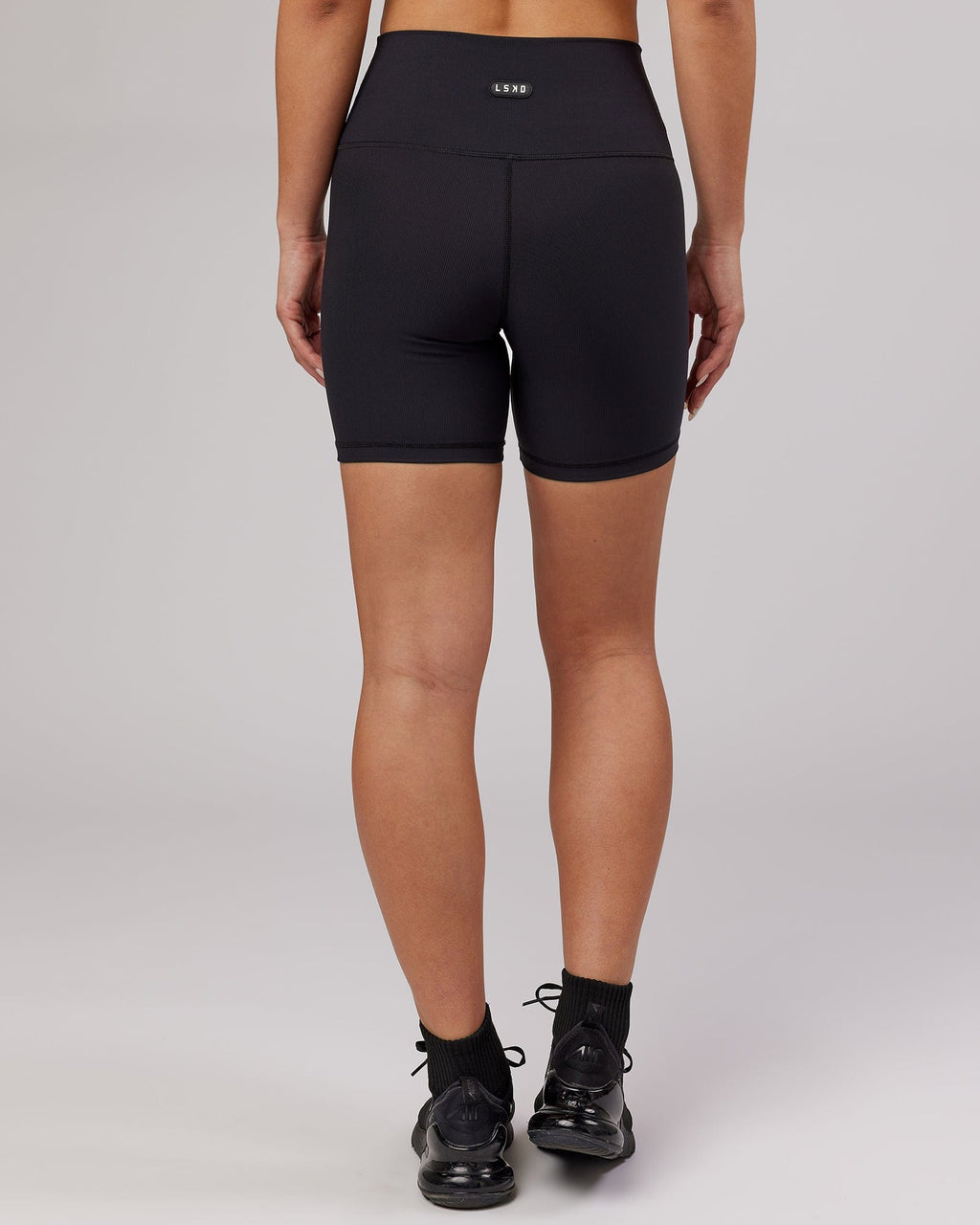 Model wearing Balance Ribbed Mid Short Tight - Black