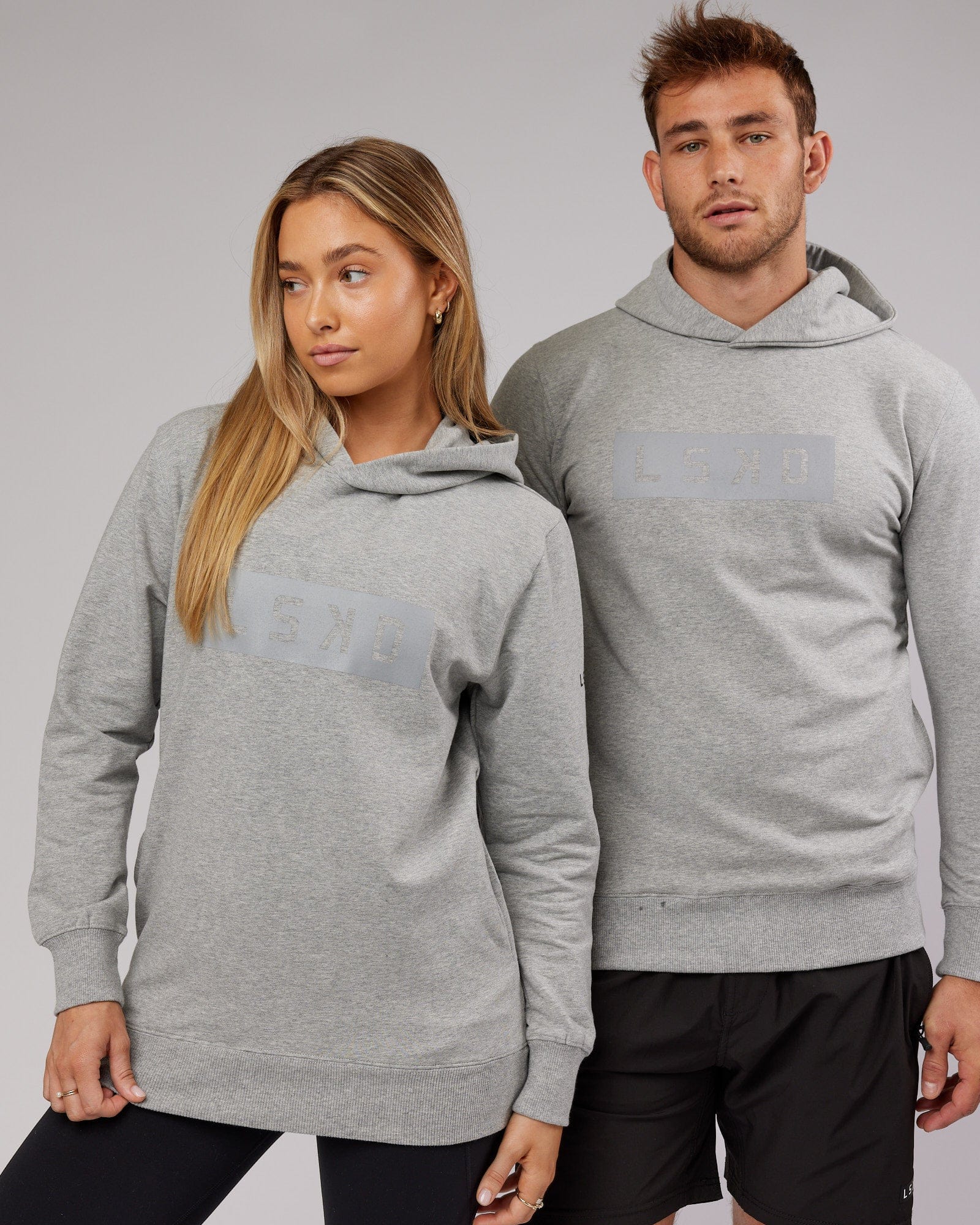 Model wearing Unisex Strength FLXFleece Training Fit Hoodie - Lt Grey Marl