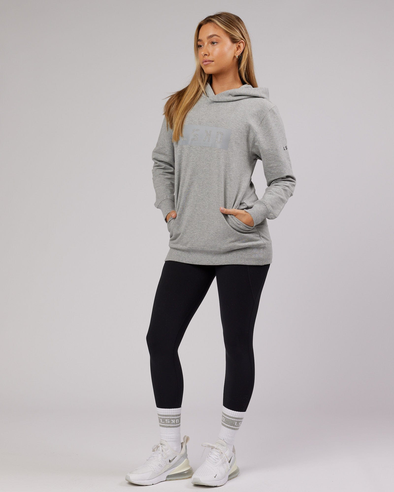 Model wearing Unisex Strength FLXFleece Training Fit Hoodie - Lt Grey Marl