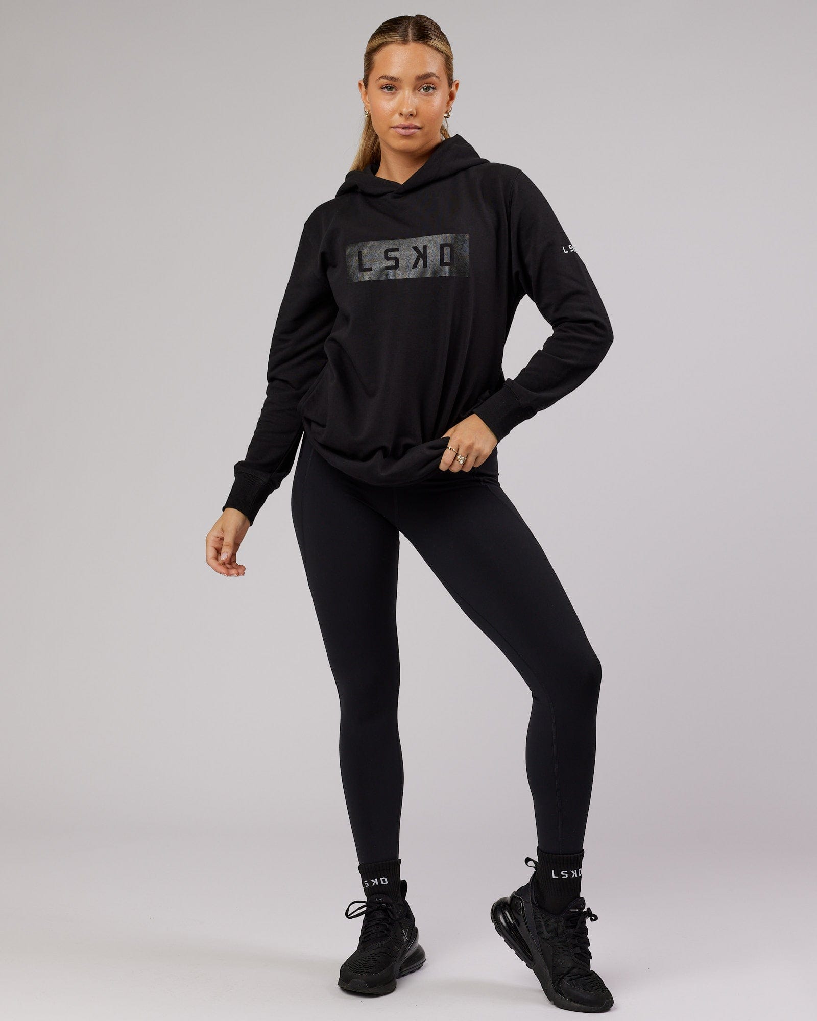 Model wearing Unisex Strength FLXFleece Training Fit Hoodie - Black