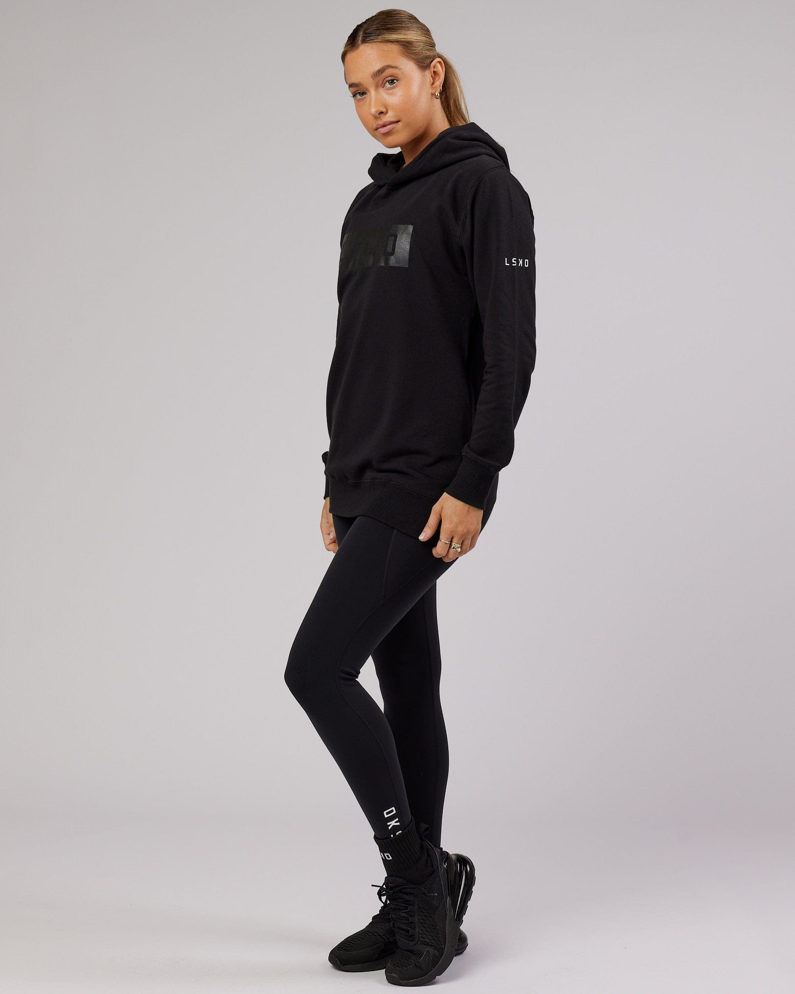 Model wearing Unisex Strength FLXFleece Training Fit Hoodie - Black