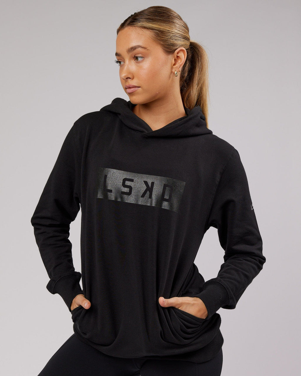 Model wearing Unisex Strength FLXFleece Training Fit Hoodie - Black