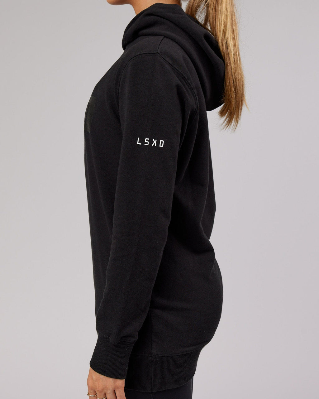 Model wearing Unisex Strength FLXFleece Training Fit Hoodie - Black