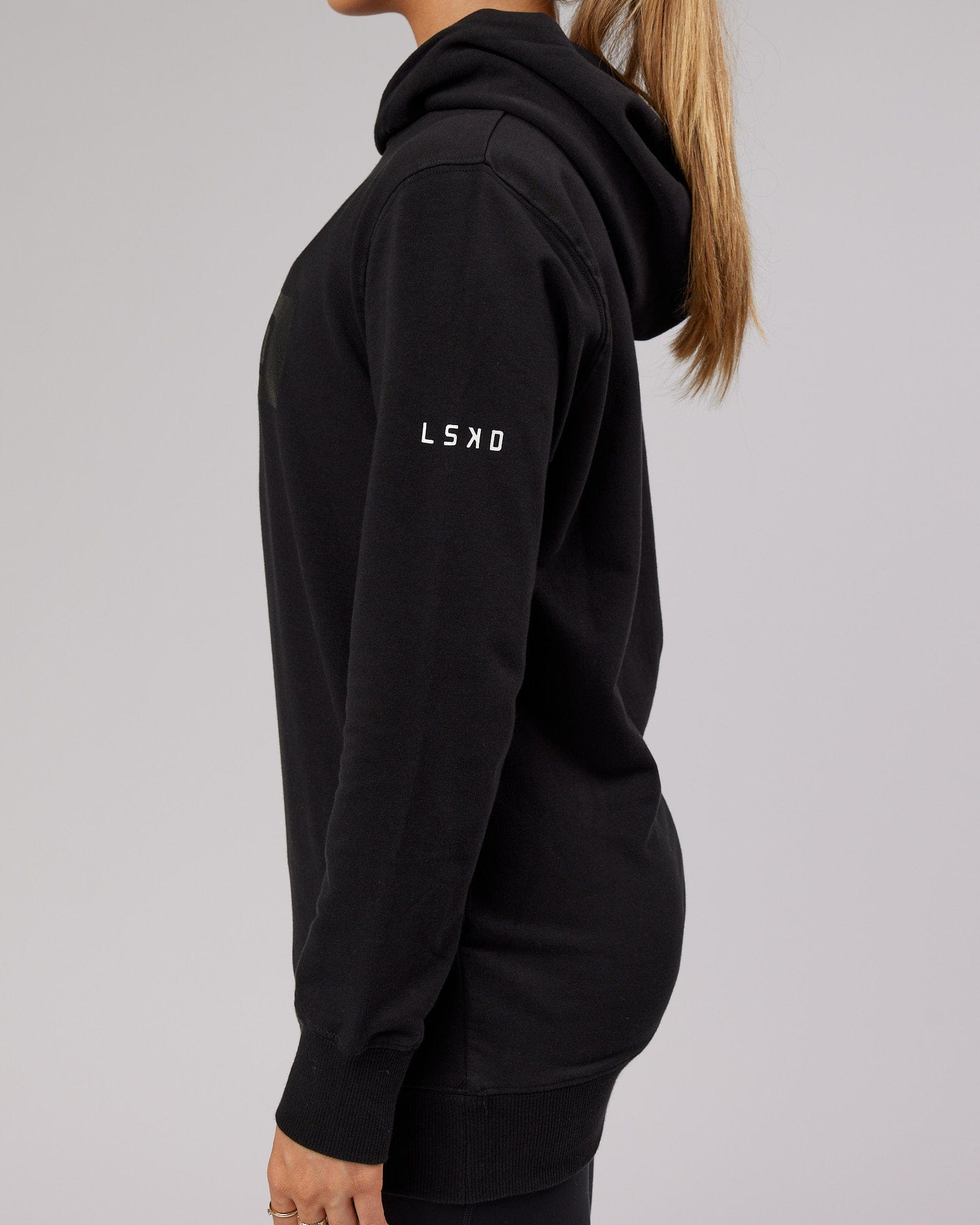 Model wearing Unisex Strength FLXFleece Training Fit Hoodie - Black