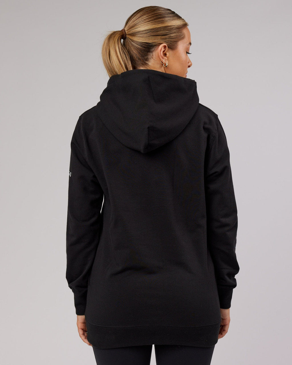 Model wearing Unisex Strength FLXFleece Training Fit Hoodie - Black