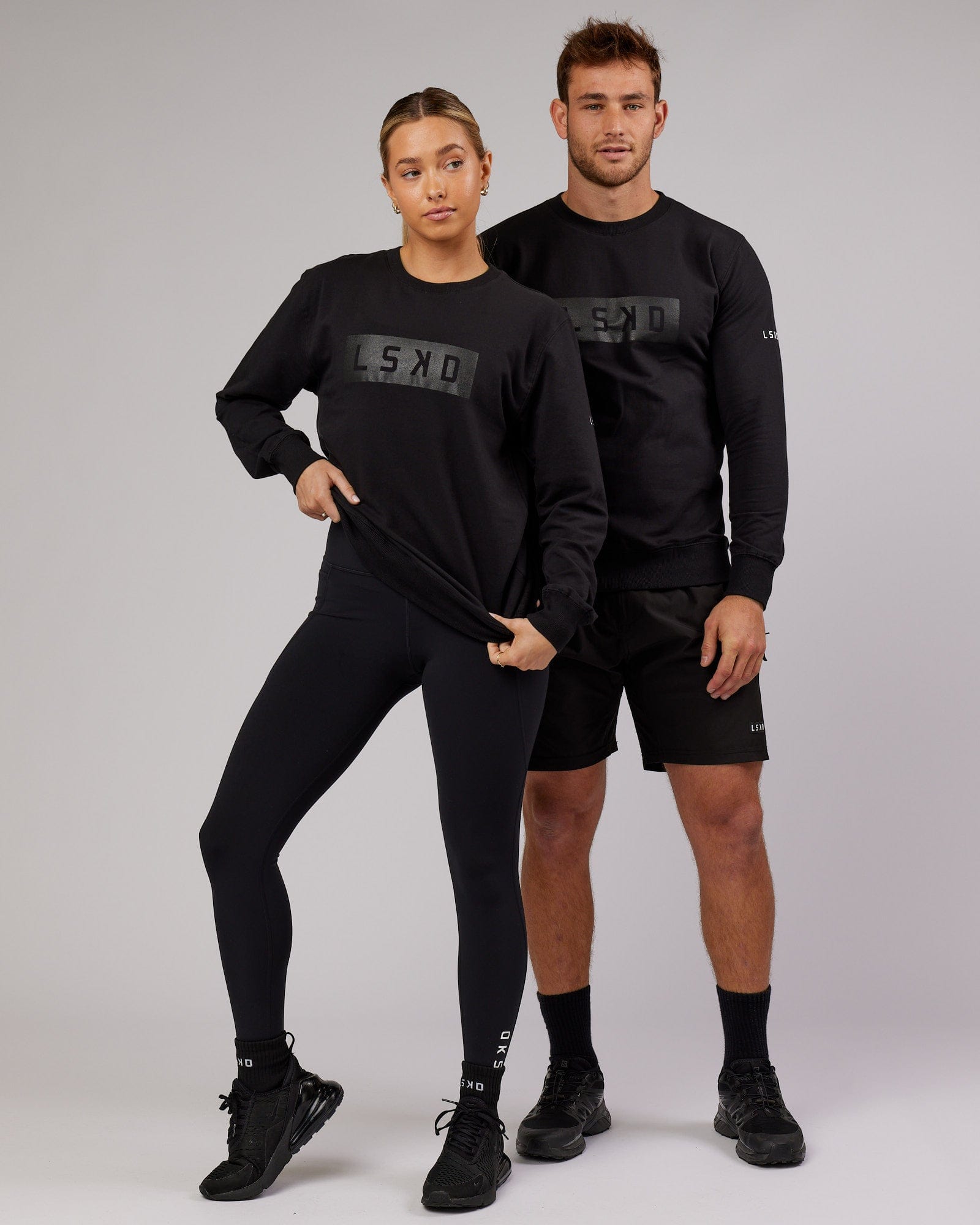 Model wearing Unisex Strength FLXFleece Training Fit Sweater - Black
