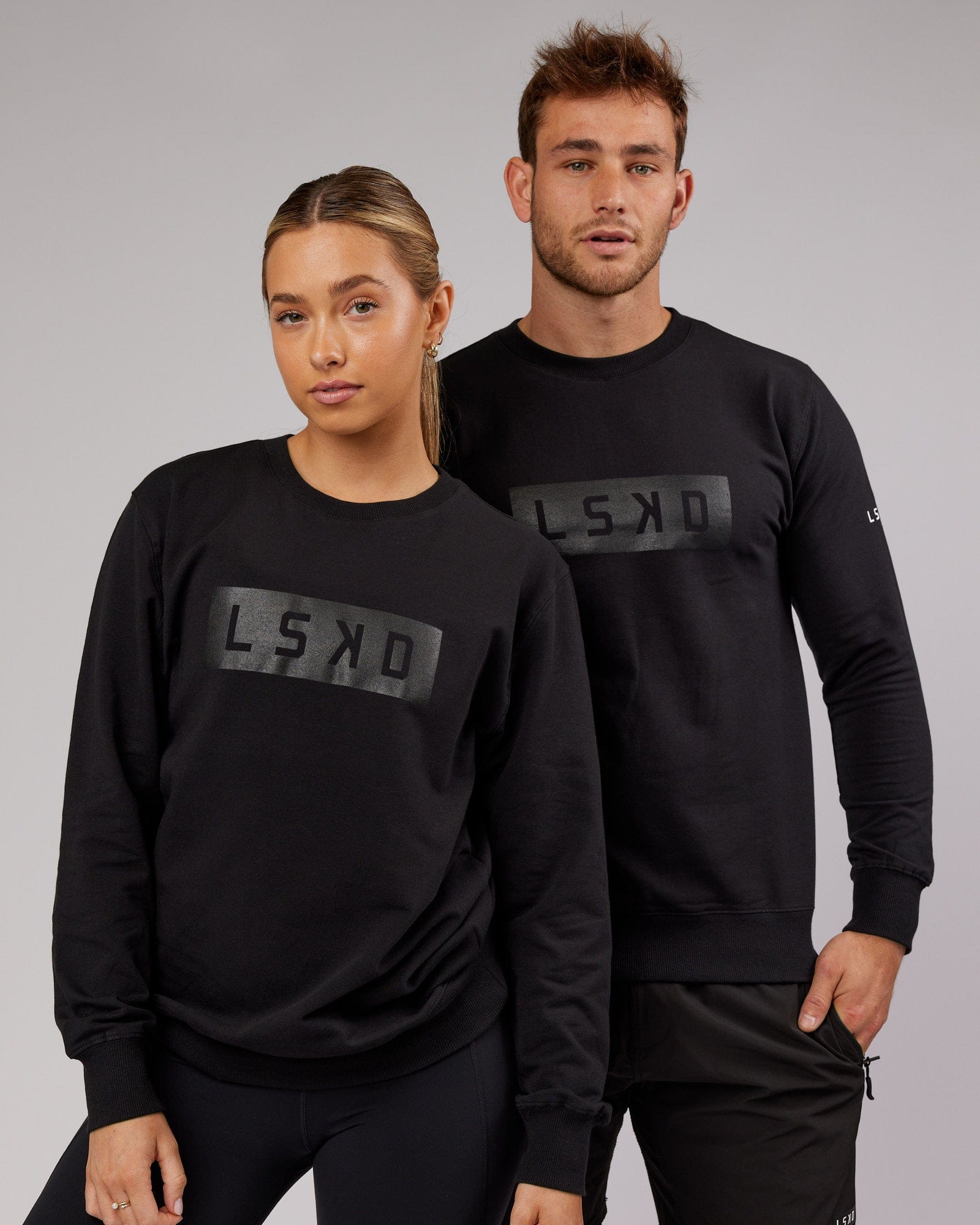 Model wearing Unisex Strength FLXFleece Training Fit Sweater - Black