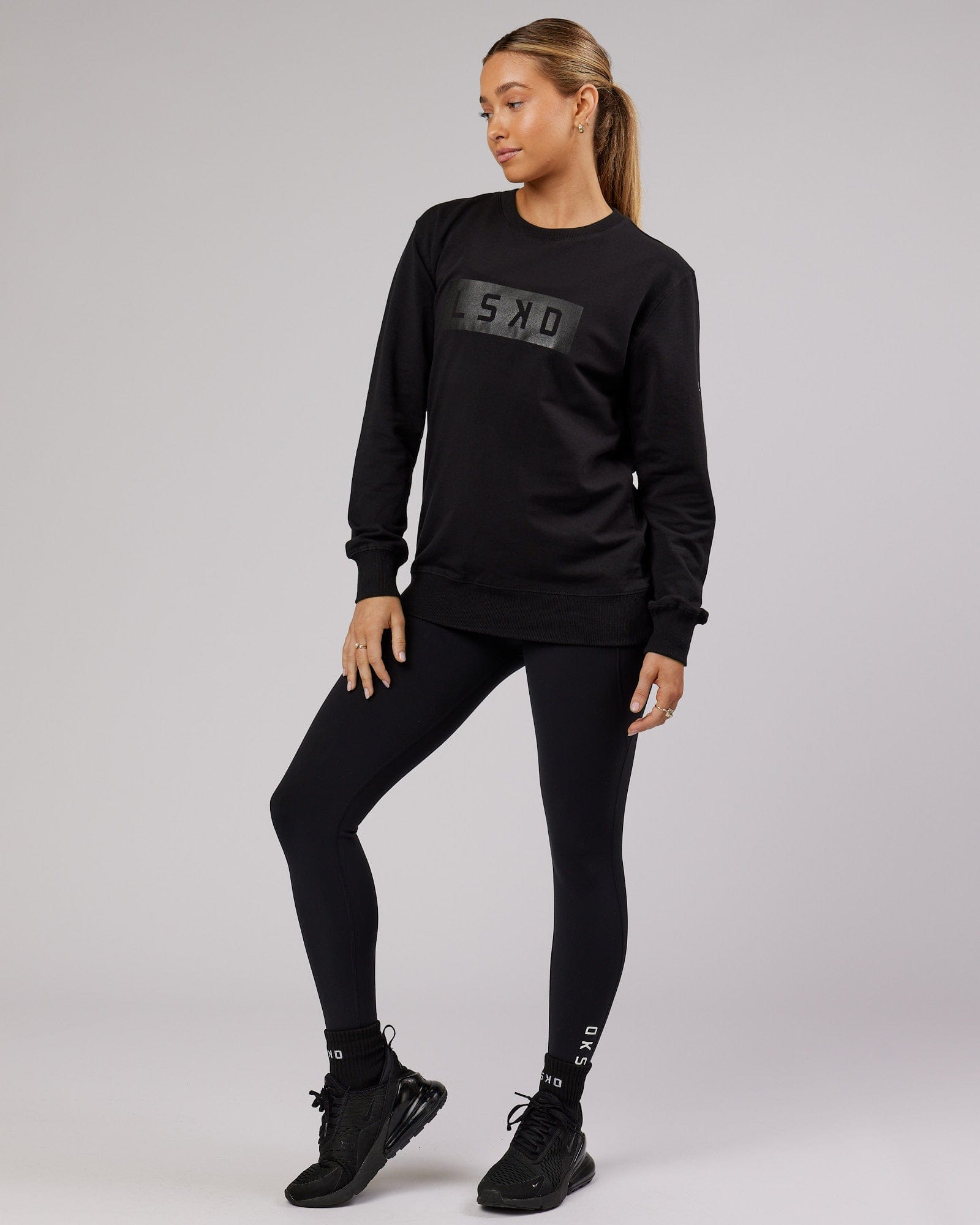Model wearing Unisex Strength FLXFleece Training Fit Sweater - Black