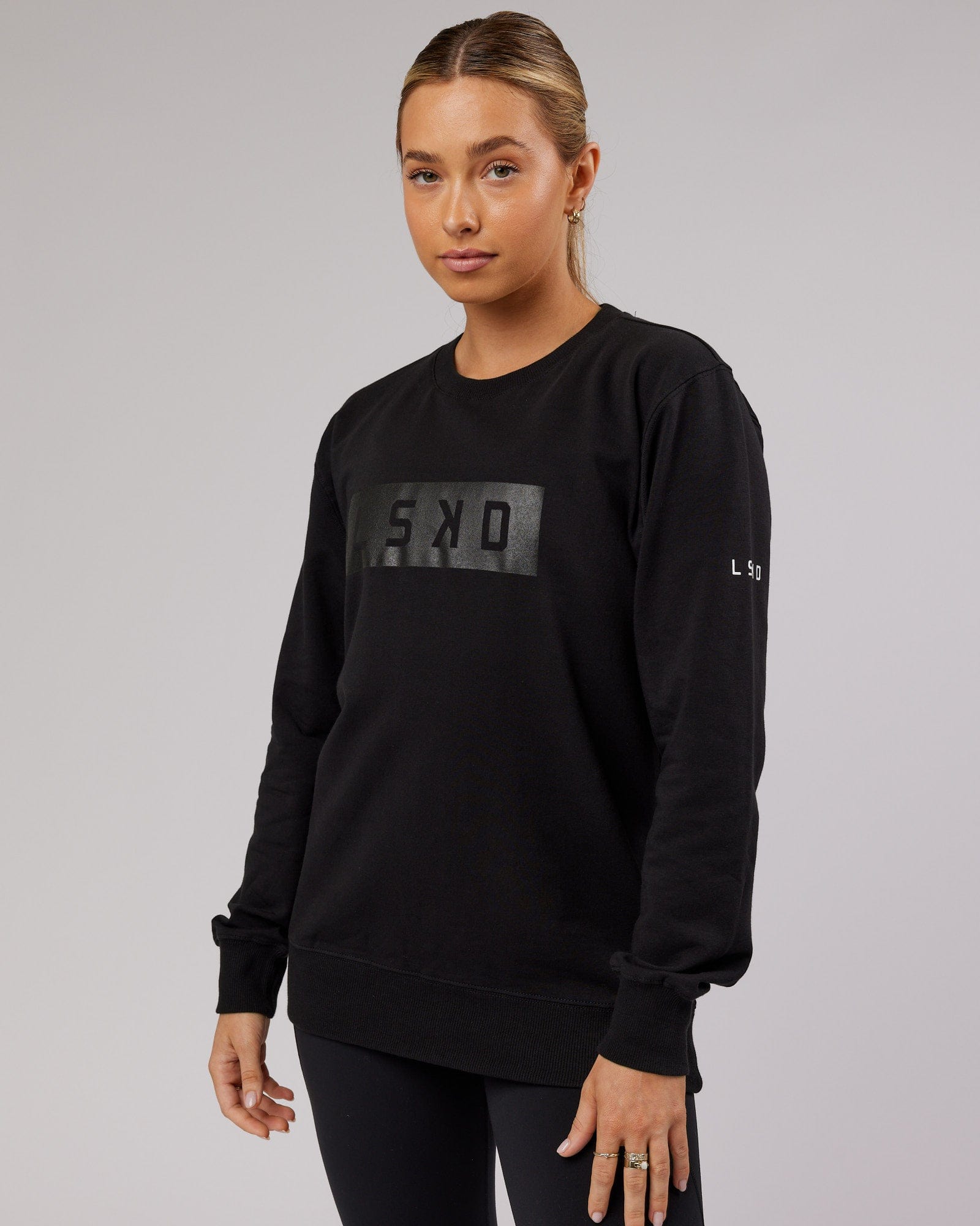 Model wearing Unisex Strength FLXFleece Training Fit Sweater - Black