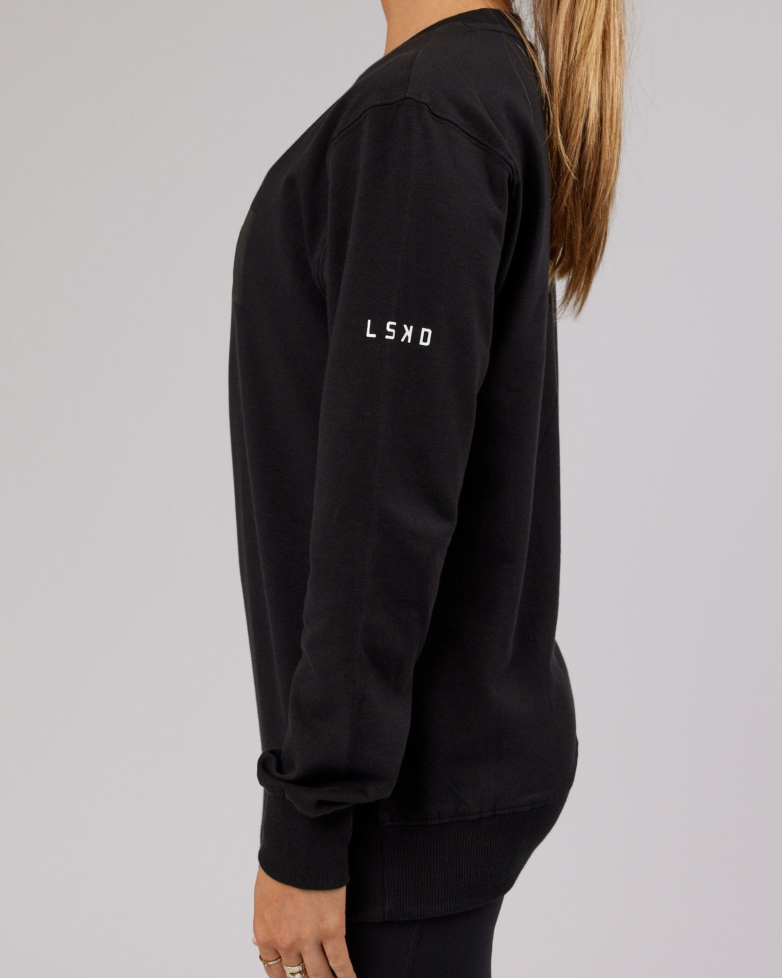 Model wearing Unisex Strength FLXFleece Training Fit Sweater - Black