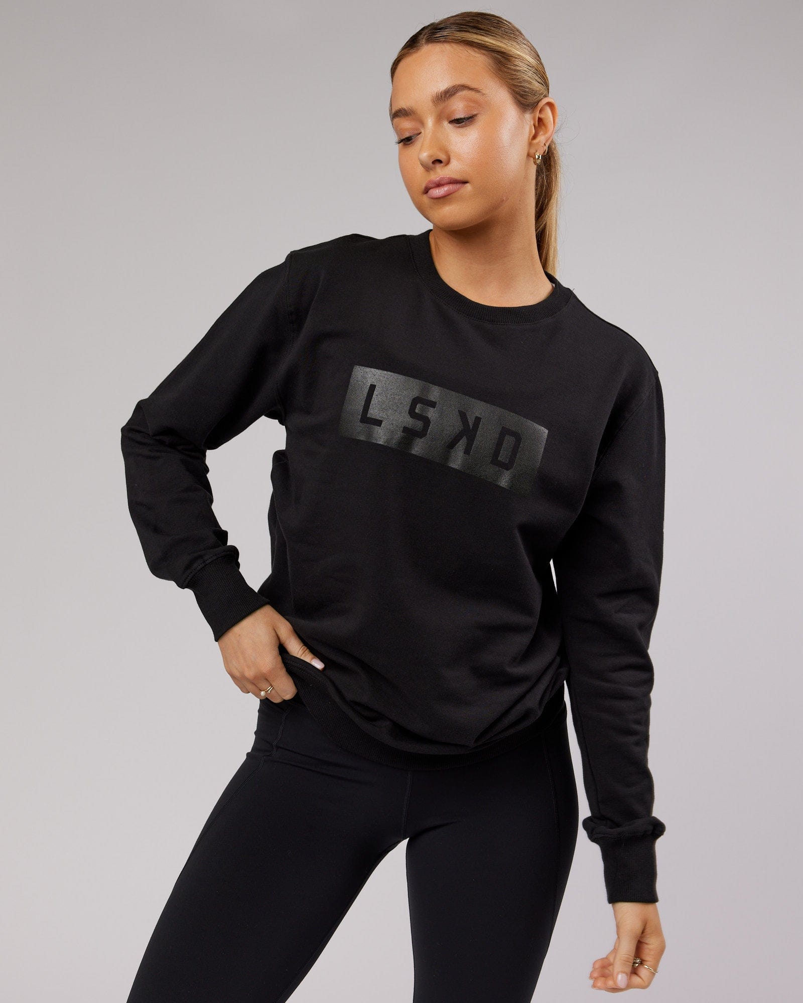 Model wearing Unisex Strength FLXFleece Training Fit Sweater - Black