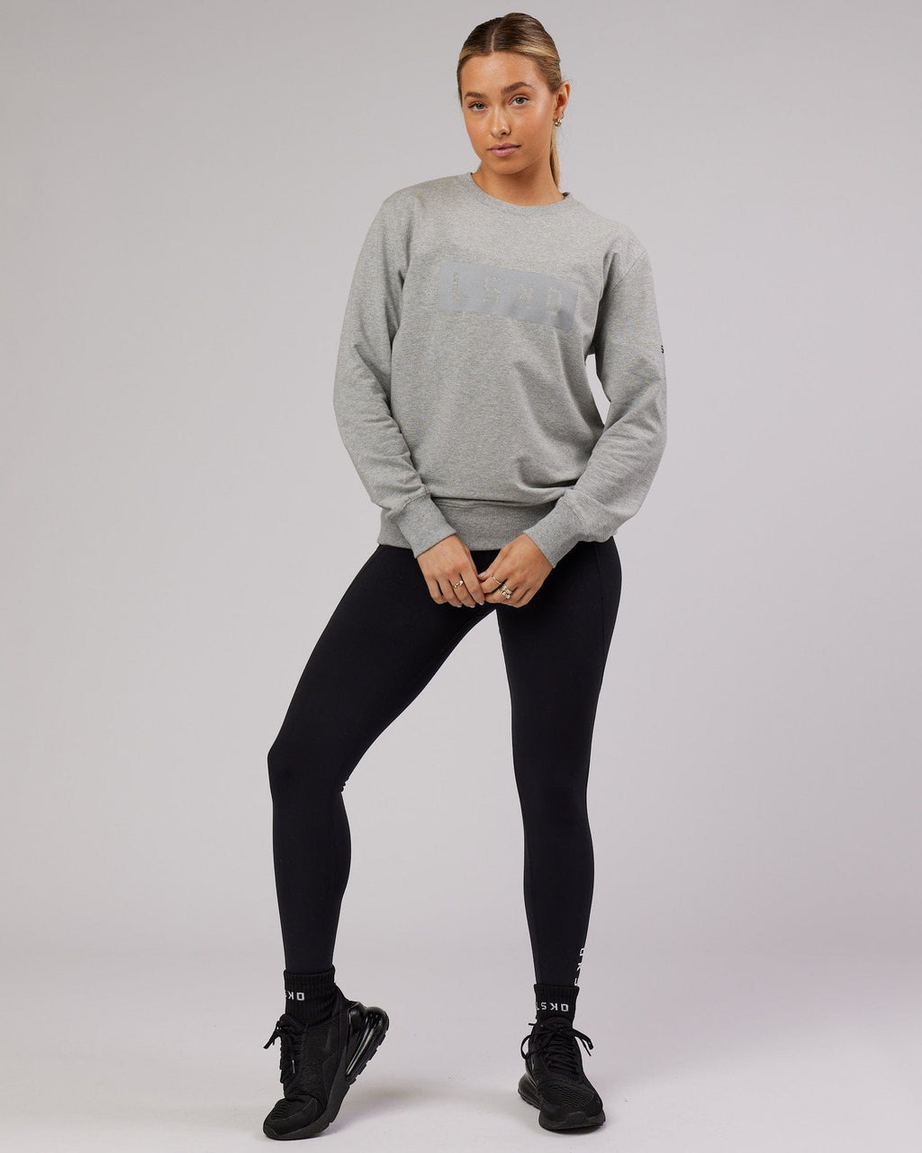 Model wearing Unisex Strength FLXFleece Training Fit Sweater - Lt Grey Marl