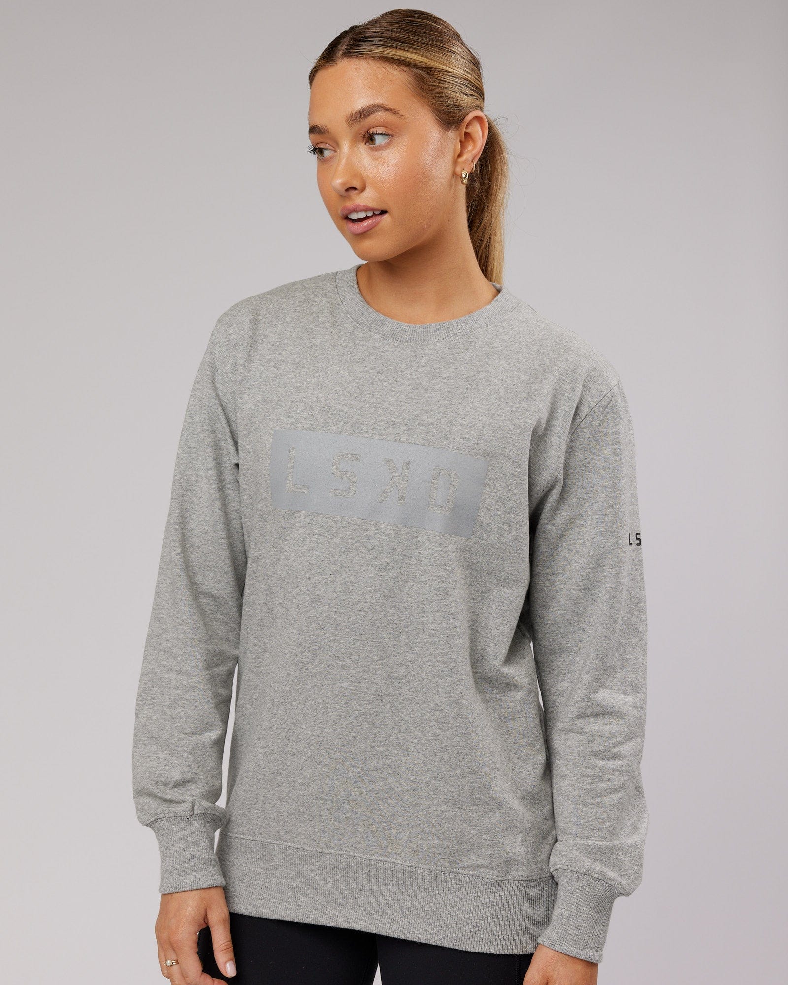 Model wearing Unisex Strength FLXFleece Training Fit Sweater - Lt Grey Marl