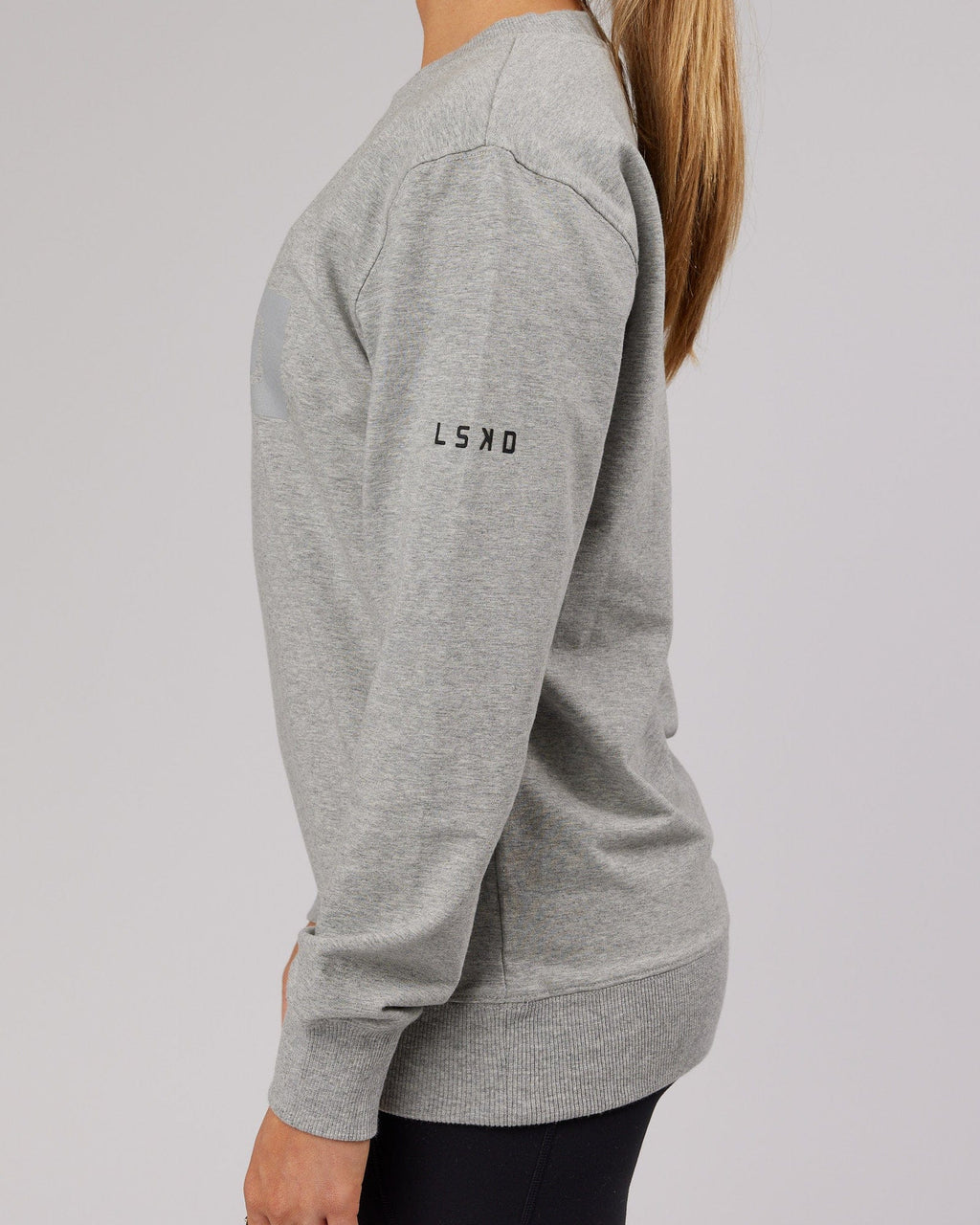 Model wearing Unisex Strength FLXFleece Training Fit Sweater - Lt Grey Marl