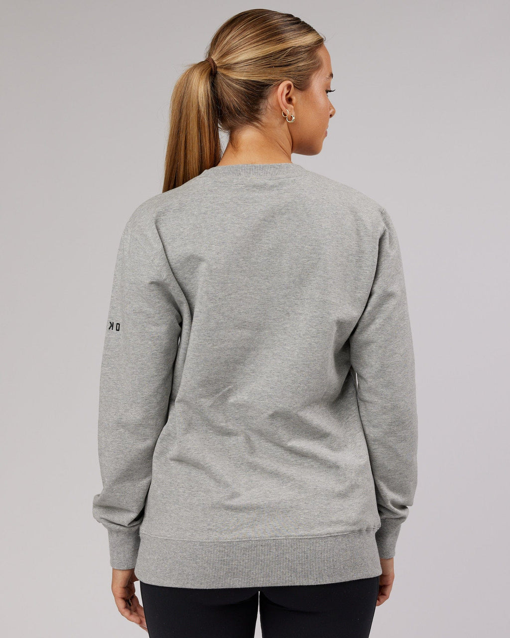 Model wearing Unisex Strength FLXFleece Training Fit Sweater - Lt Grey Marl
