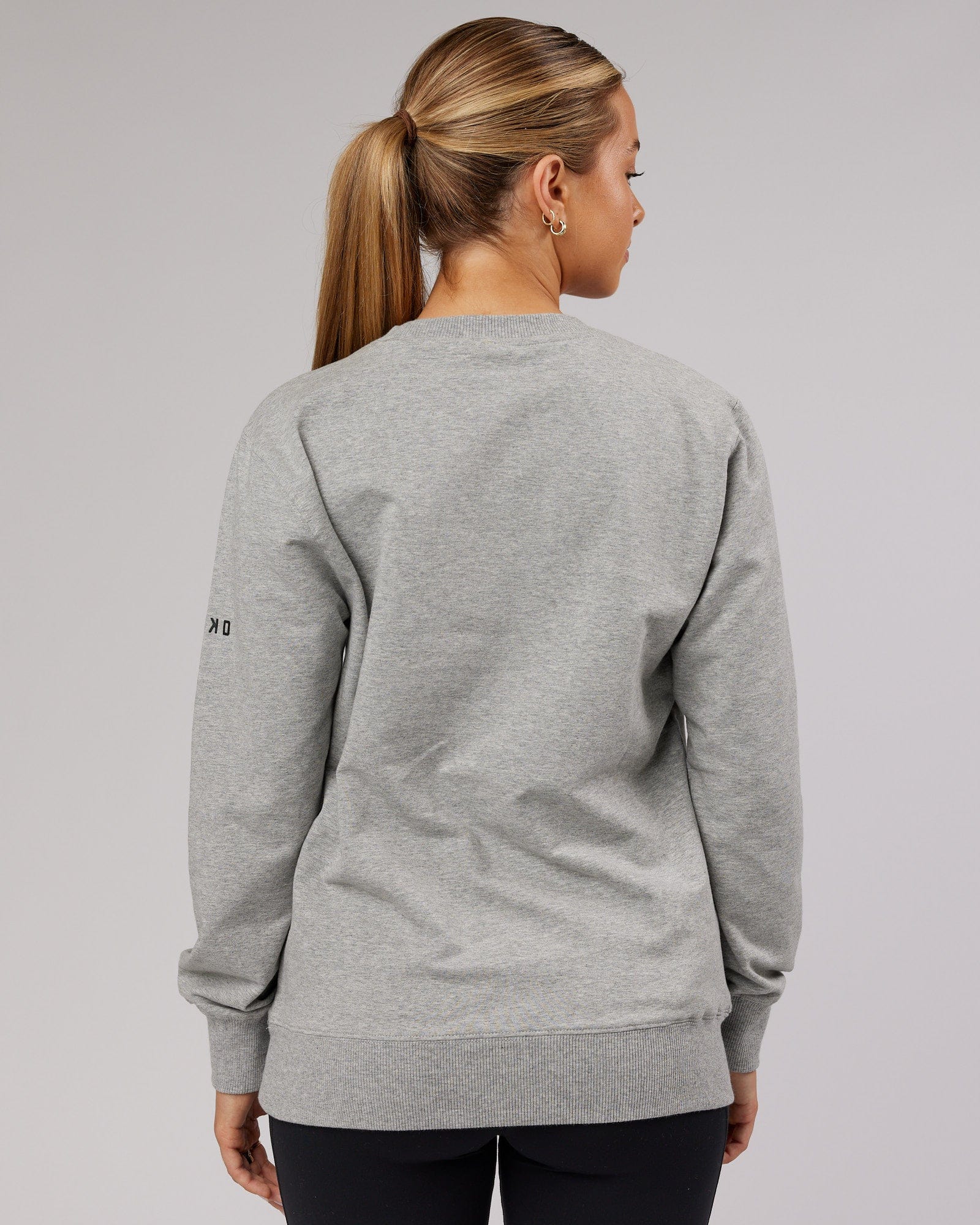 Model wearing Unisex Strength FLXFleece Training Fit Sweater - Lt Grey Marl