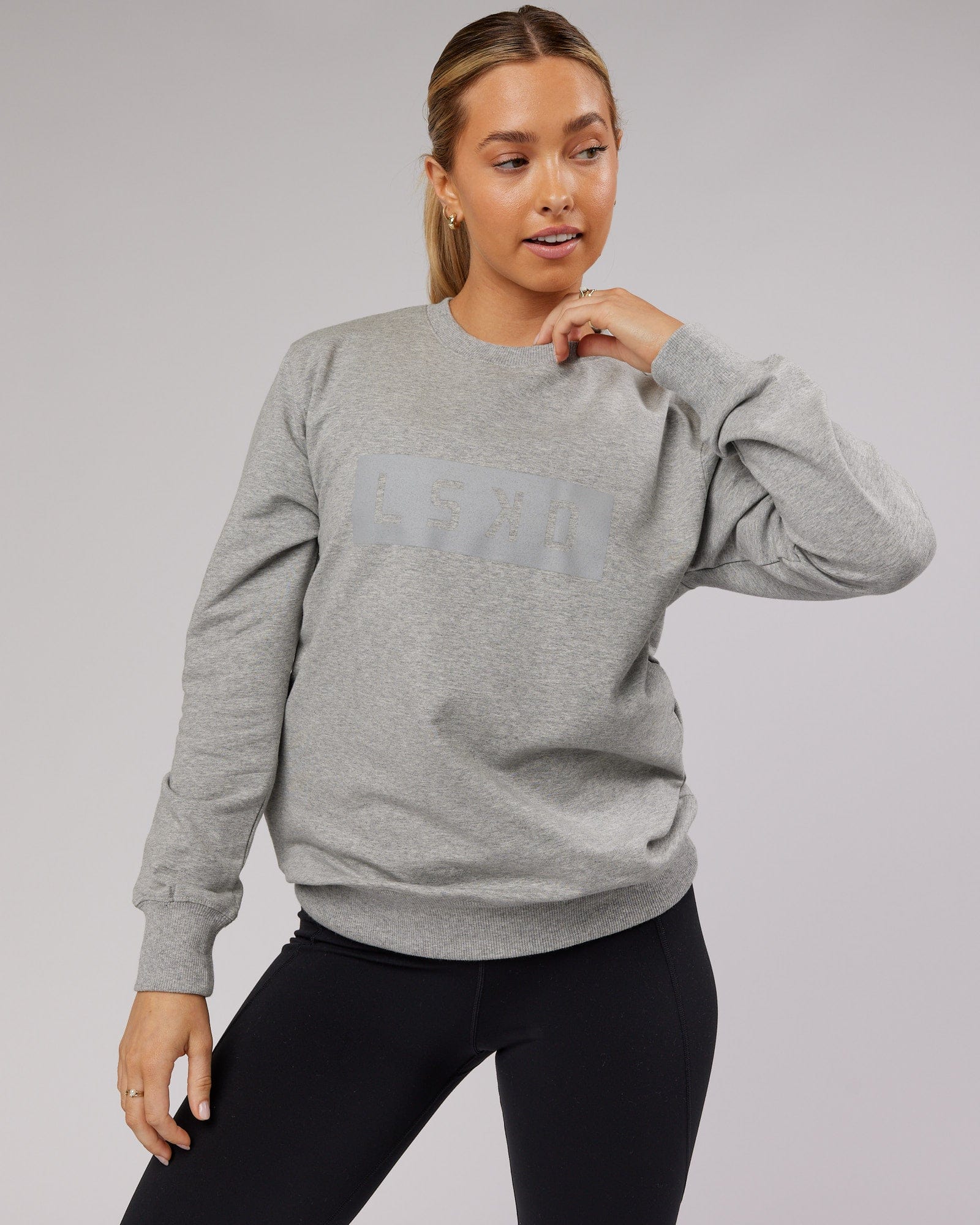 Model wearing Unisex Strength FLXFleece Training Fit Sweater - Lt Grey Marl