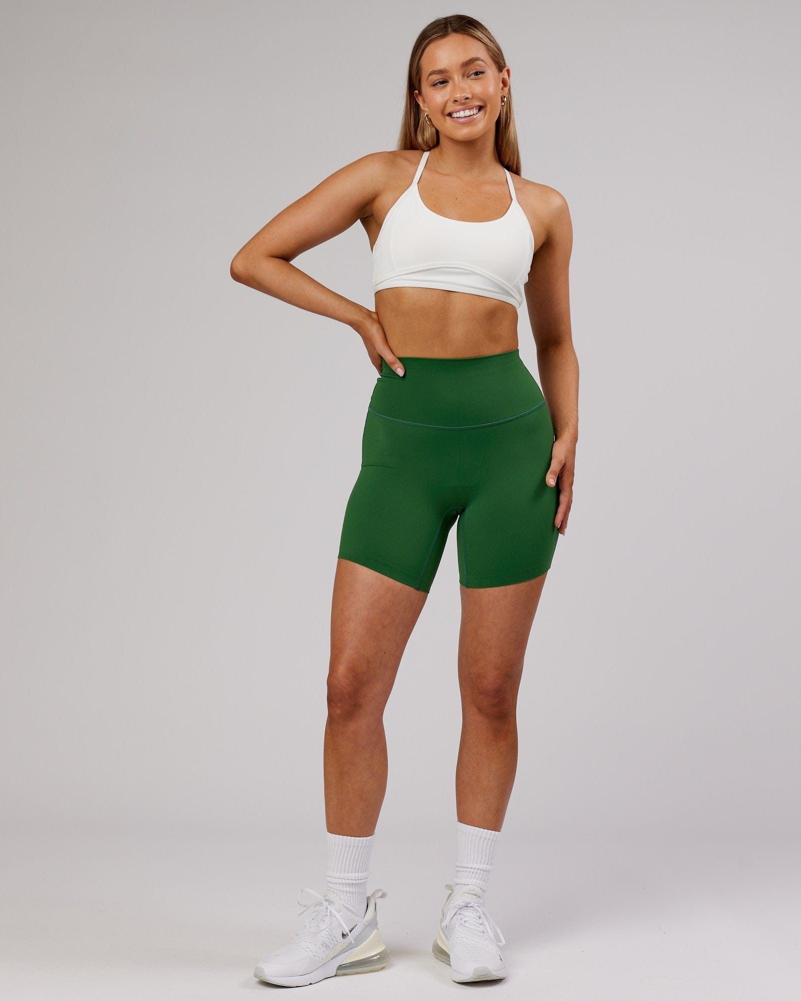 Model wearing Elixir Mid Short Tight - Eden Green No Logo