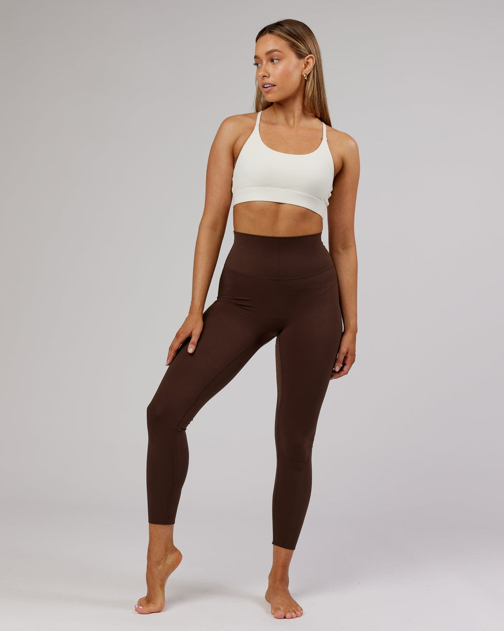 Model wearing Elixir Sports Bra - Cream