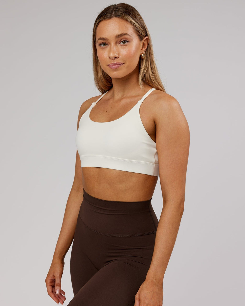 Model wearing Elixir Sports Bra - Cream
