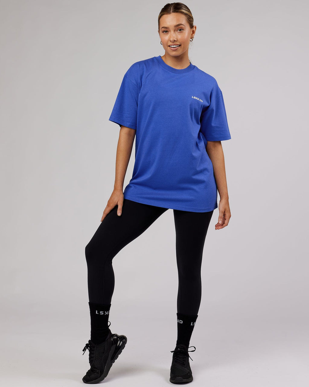 Model wearing Unisex Revolution Heavyweight Tee Oversize - Power Cobalt