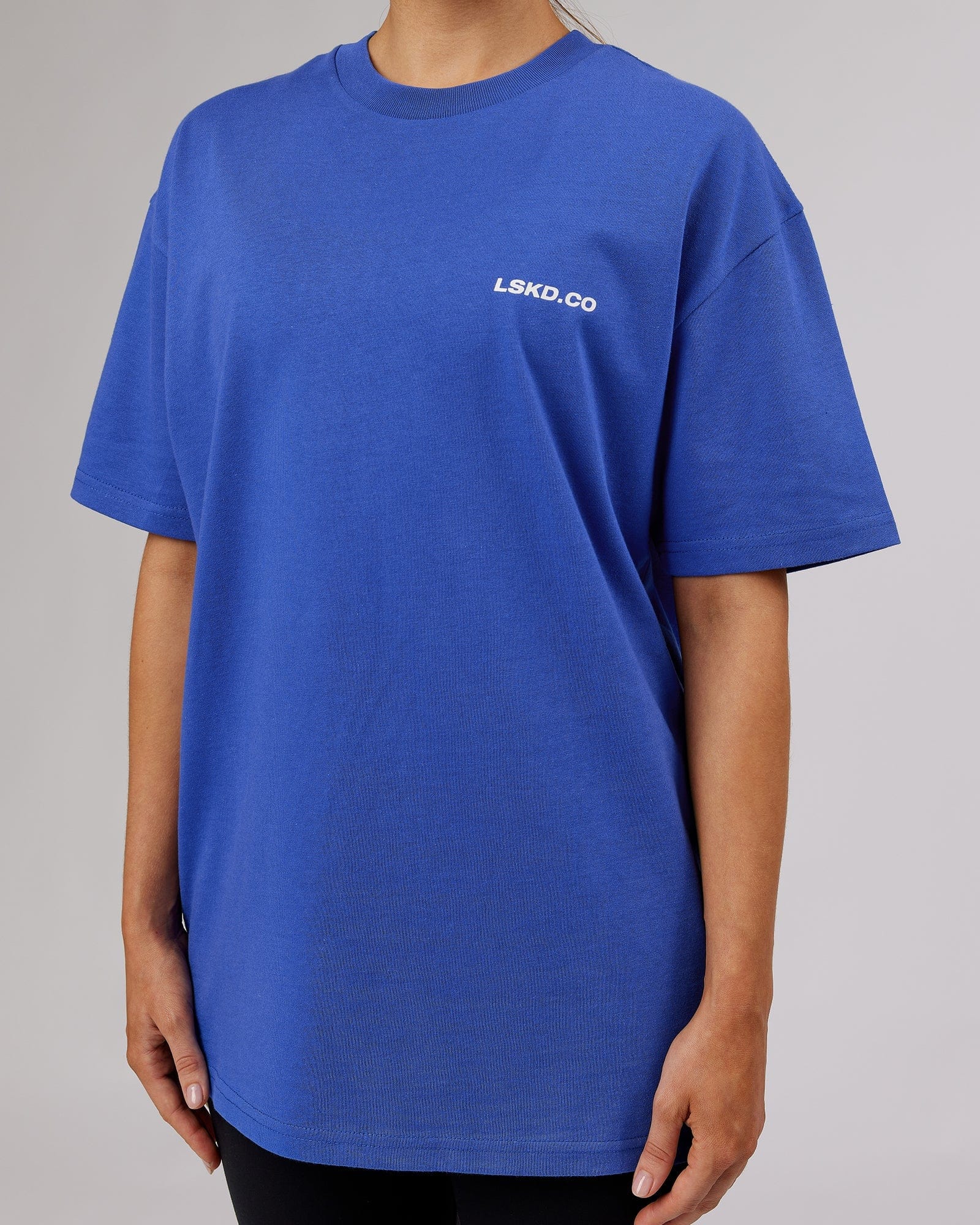 Model wearing Unisex Revolution Heavyweight Tee Oversize - Power Cobalt