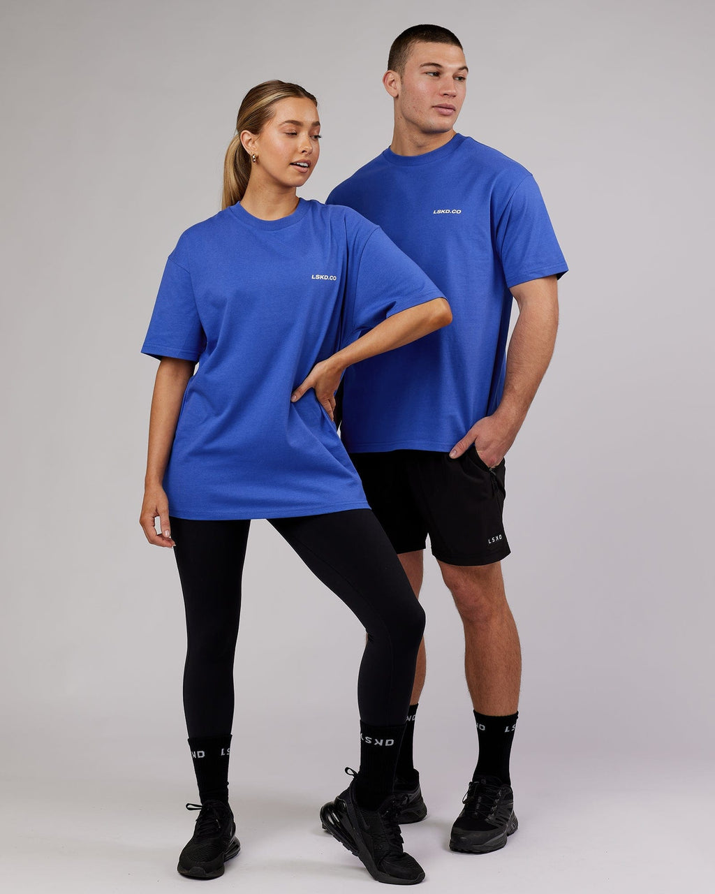 Model wearing Unisex Revolution Heavyweight Tee Oversize - Power Cobalt