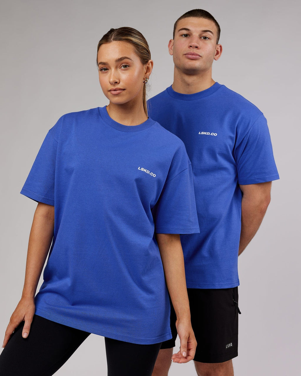 Model wearing Unisex Revolution Heavyweight Tee Oversize - Power Cobalt