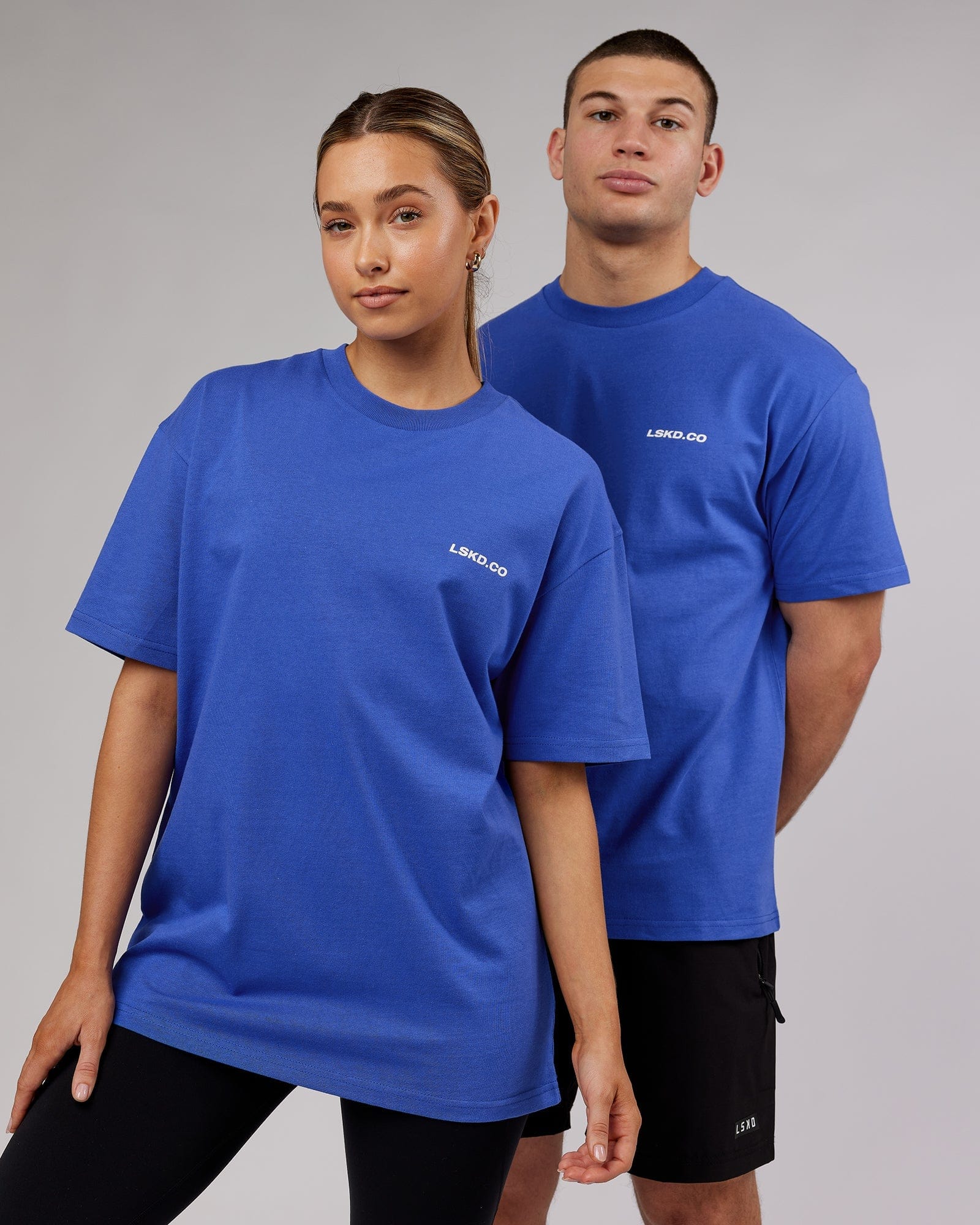 Model wearing Unisex Revolution Heavyweight Tee Oversize - Power Cobalt