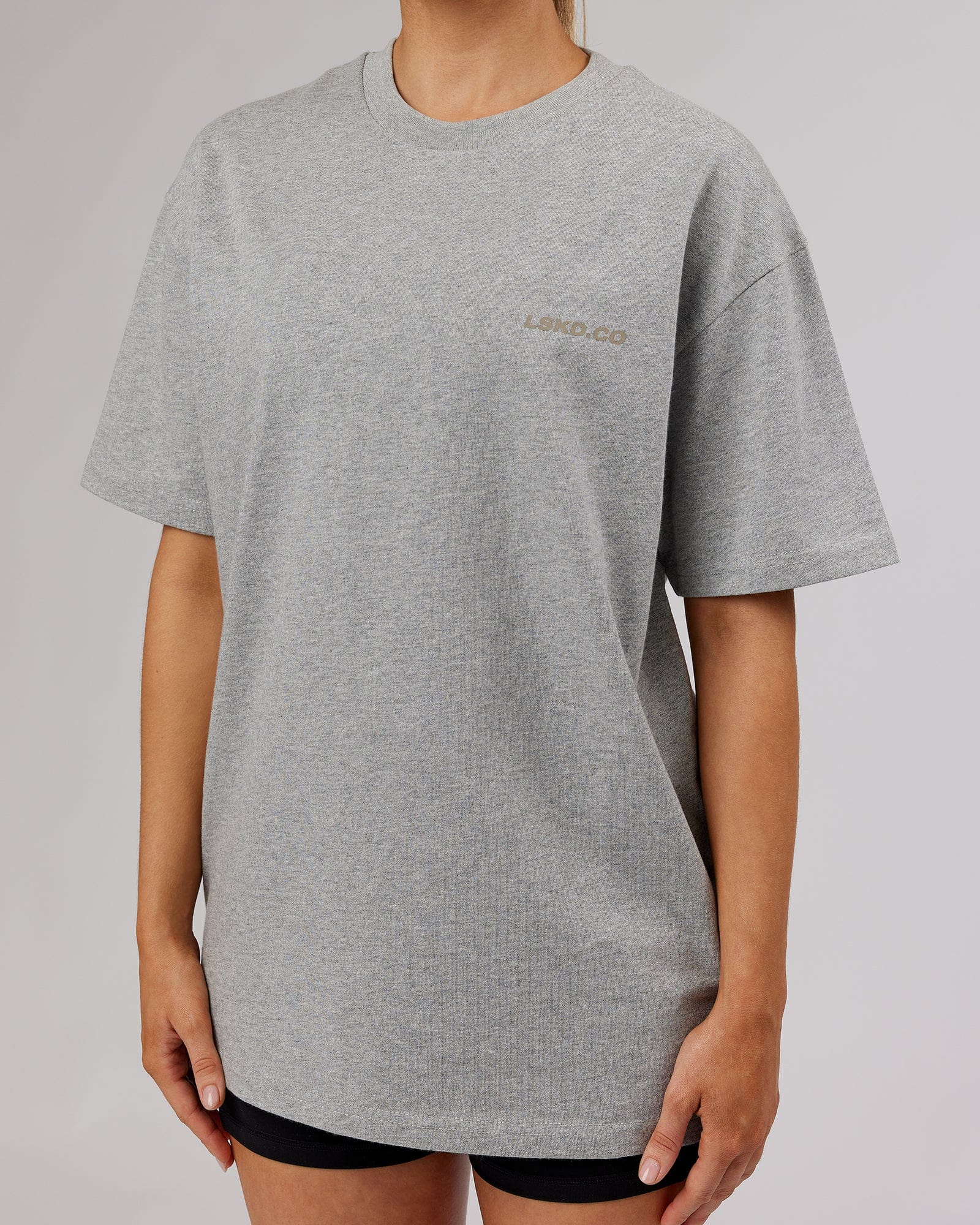 Model wearing Unisex Revolution Heavyweight Tee Oversize - Lt Grey Marl