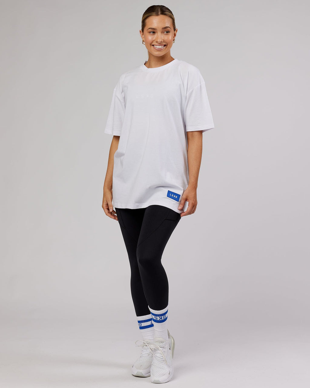 Model wearing Unisex Transfer FLXCotton Tee Oversize - White