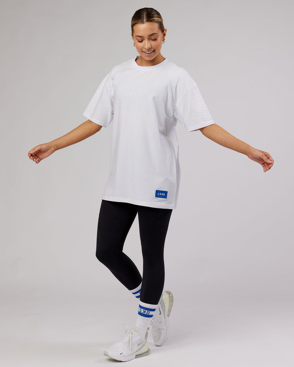 Model wearing Unisex Transfer FLXCotton Tee Oversize - White