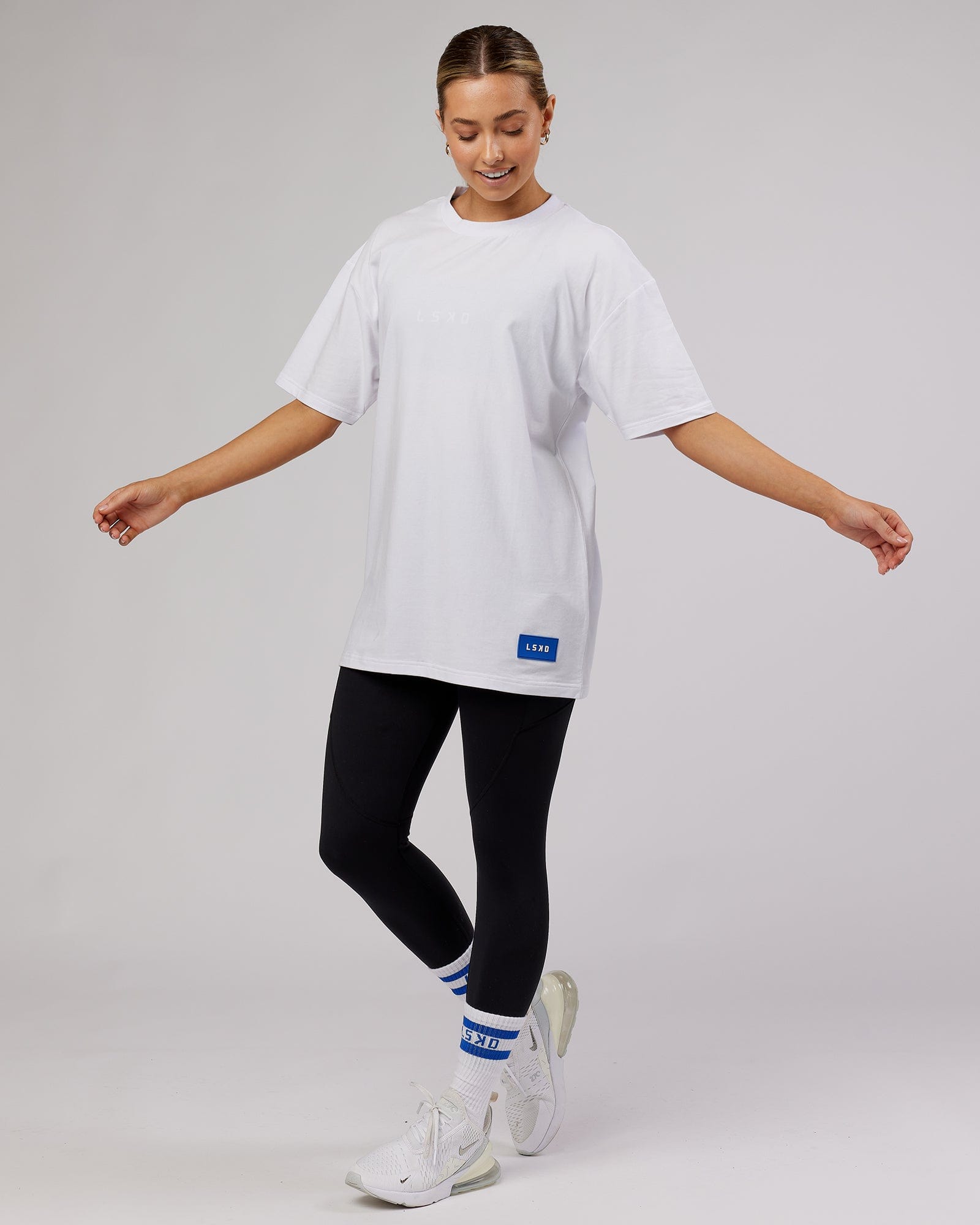 Model wearing Unisex Transfer FLXCotton Tee Oversize - White