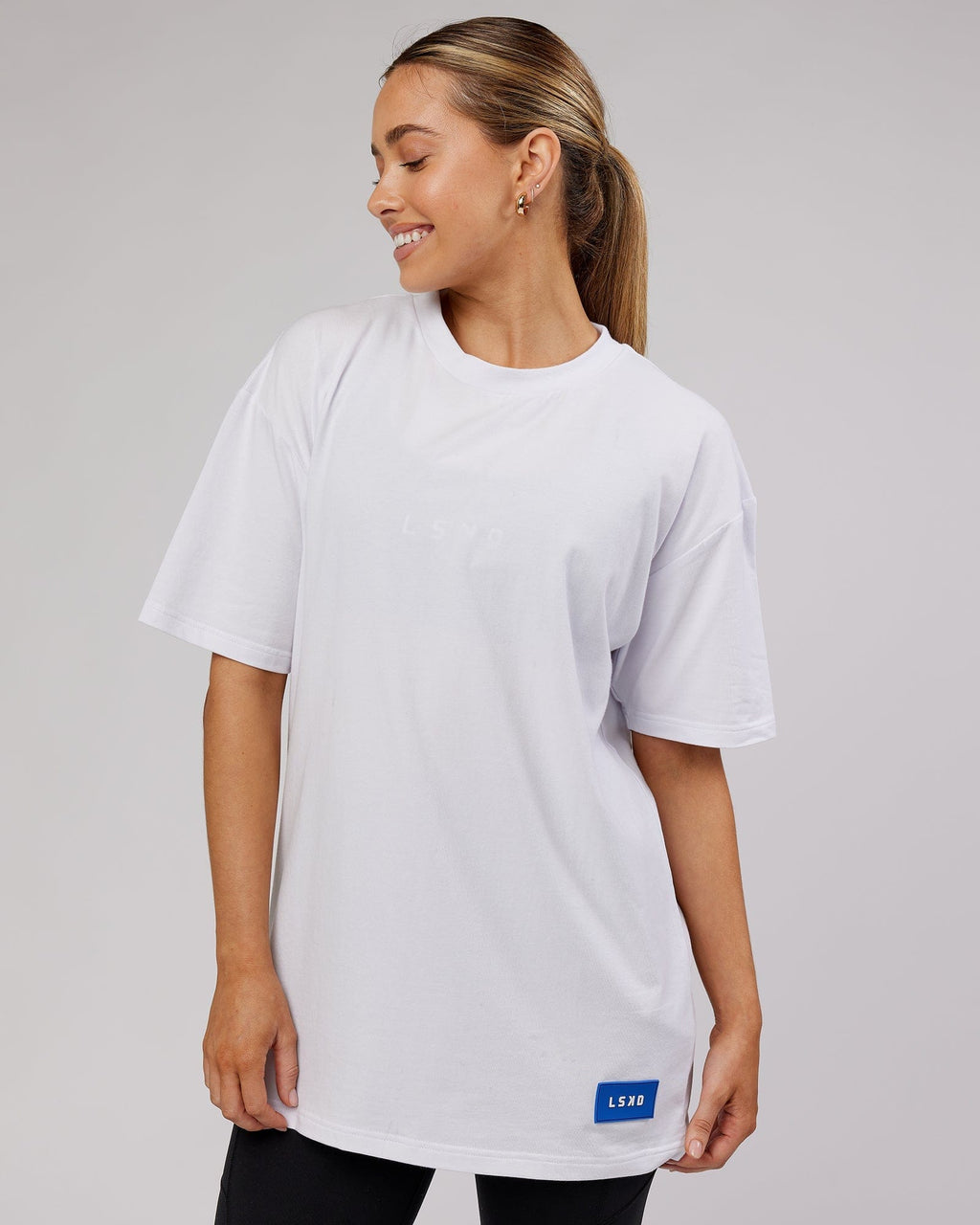Model wearing Unisex Transfer FLXCotton Tee Oversize - White