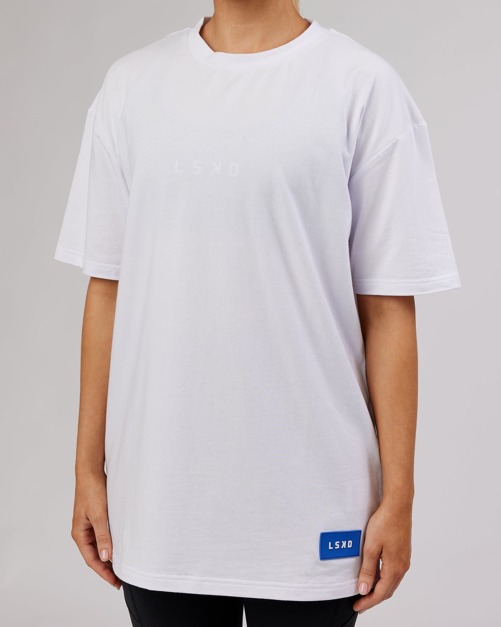 Model wearing Unisex Transfer FLXCotton Tee Oversize - White