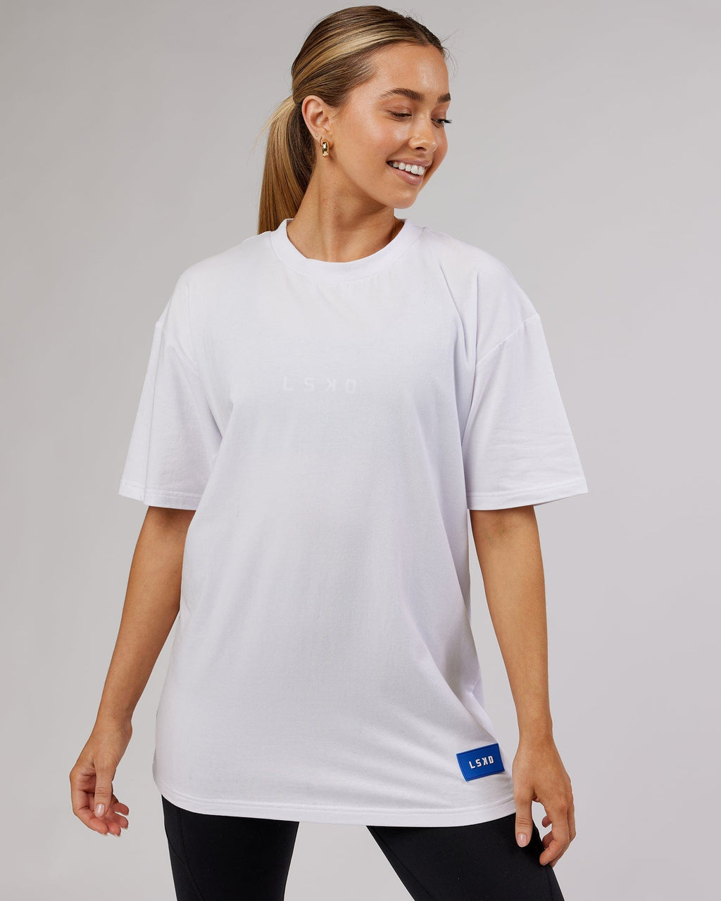 Model wearing Unisex Transfer FLXCotton Tee Oversize - White